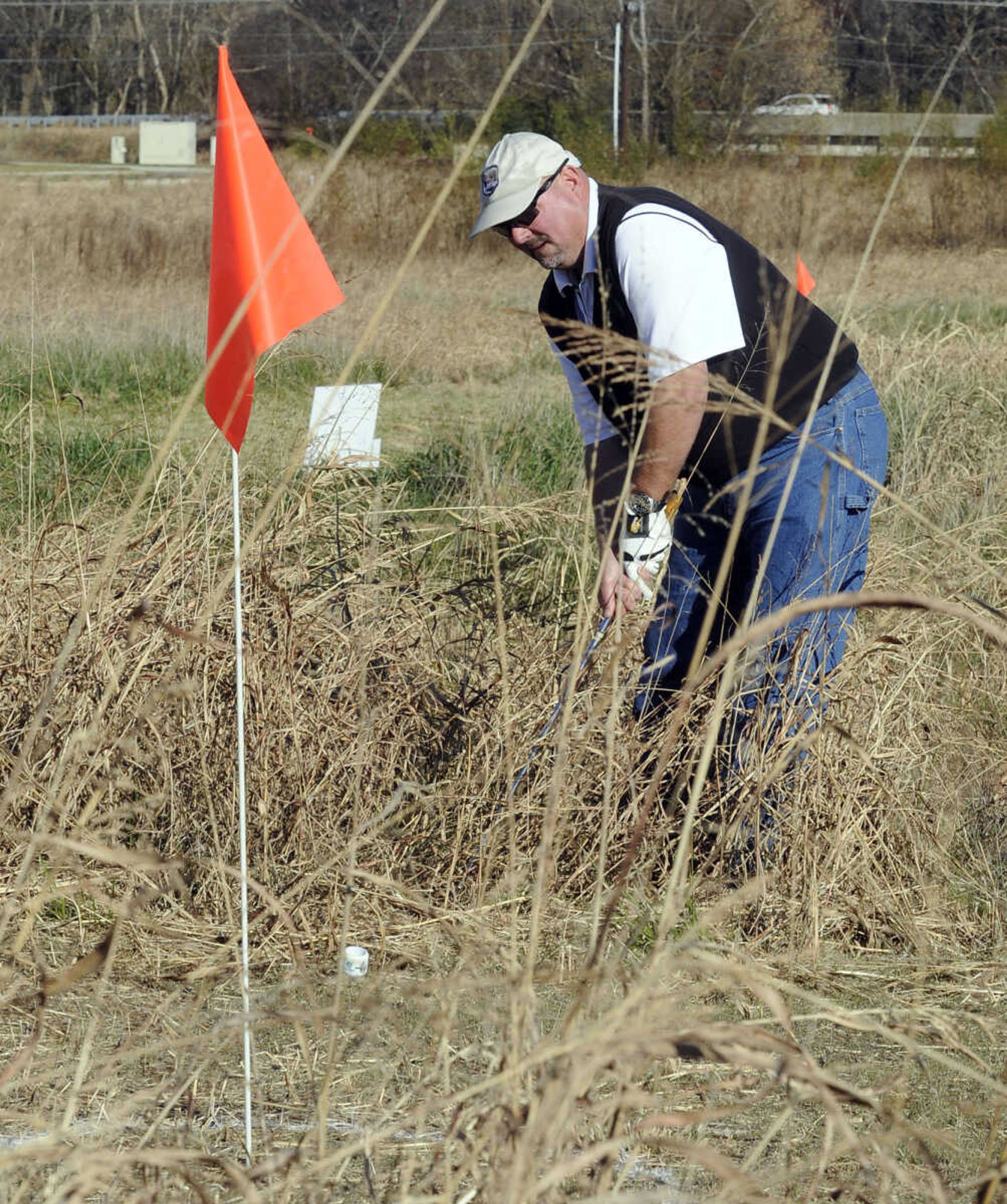 Jay Knudtson hits a BirdieBall out of the rough to the 16th hole at the Discovery Playhouse Open.