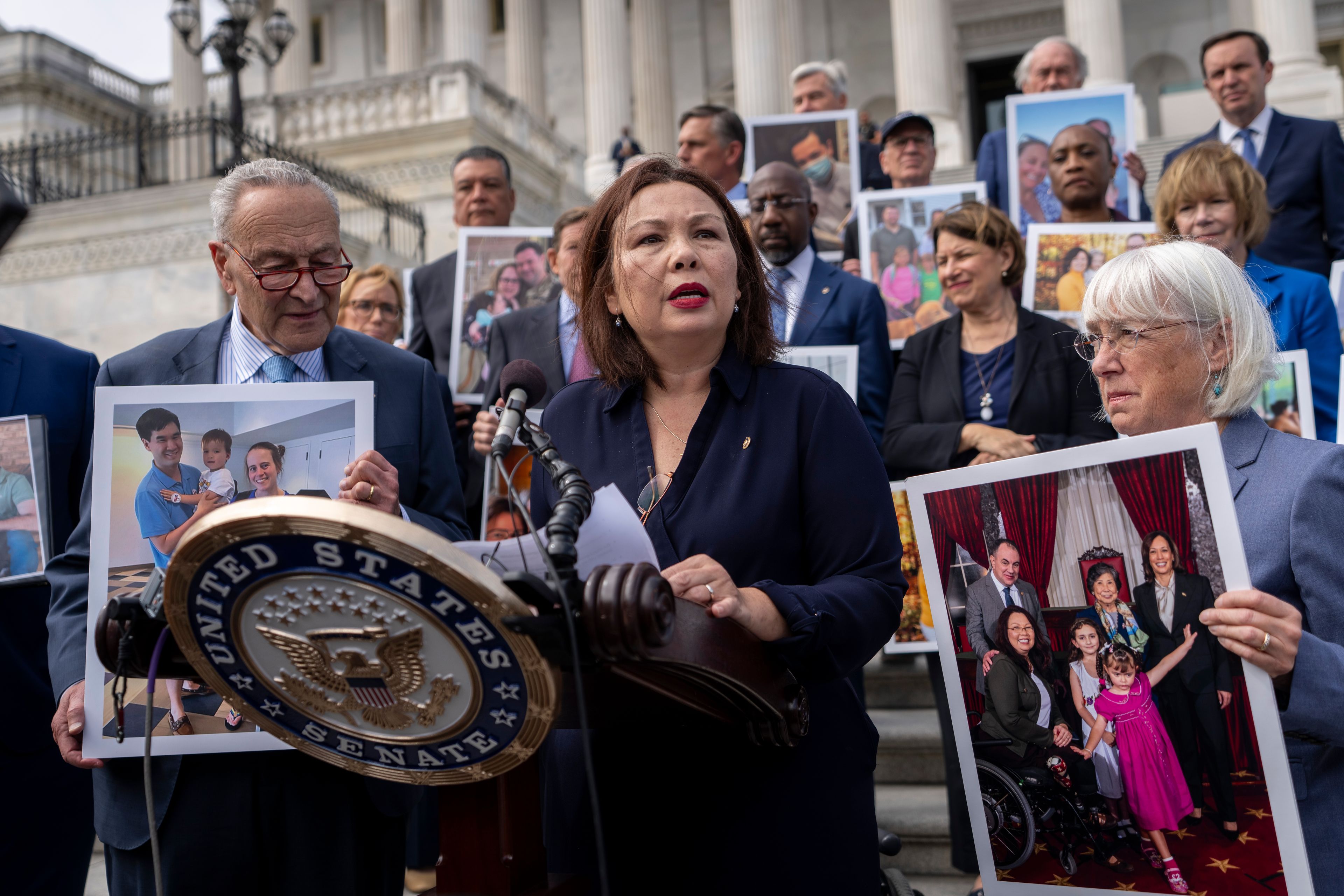 Sen. Tammy Duckworth, D-Ill., center, accompanied by Senate Majority Leader Chuck Schumer, D-NY, left, and Sen. Patty Murray, D-Wash., right, speaks about the need to protect rights to in vitro fertilization (IVF), on the Senate steps at the Capitol in Washington, Tuesday, Sept. 17, 2024. (AP Photo/Ben Curtis)