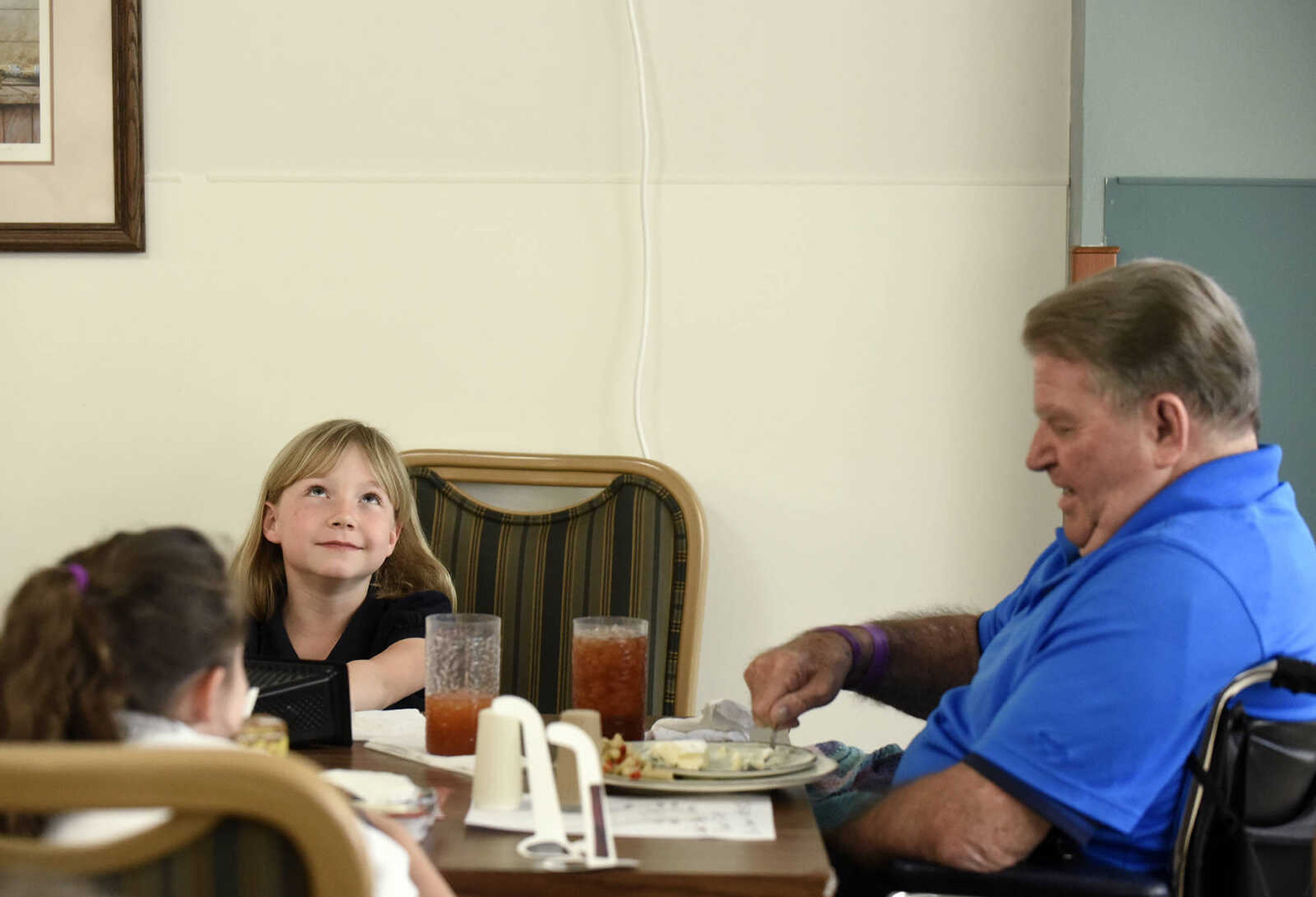 Cotton Bernard has lunch with Prodigy Leadership Academy students, Briana Lee, center, and Logan Lamont on Tuesday, April 25, 2017, at the Missouri Veterans Home in Cape Girardeau.