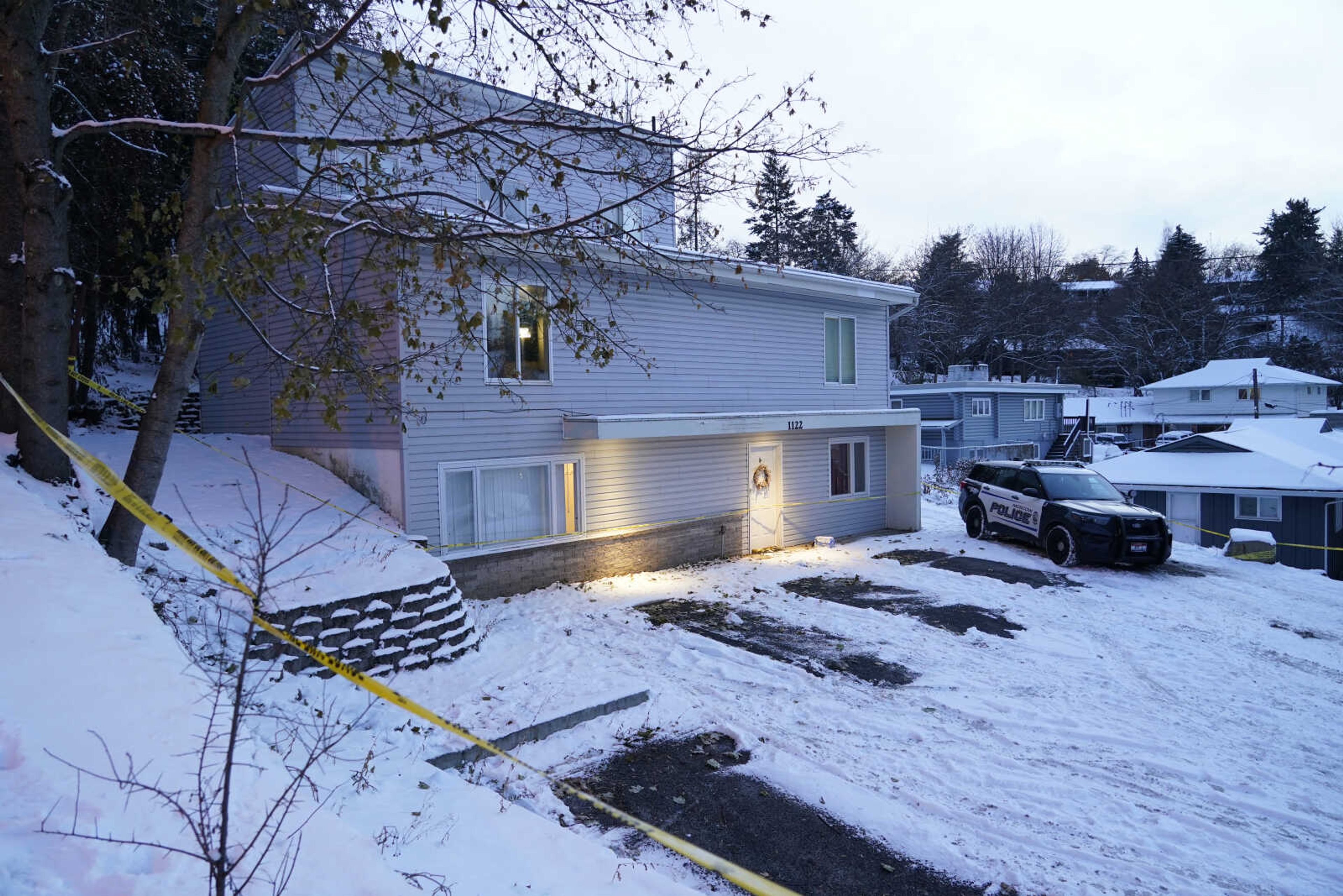 FILE - Bare spots are seen, Nov. 29, 2022, in the snowy parking lot in front of the home where four University of Idaho students were found dead on Nov. 13, in Moscow, Idaho, after vehicles belonging to the victims and others were towed away earlier in the day. Objections have been raised to demolishing the house where four University of Idaho students were killed in 2022, with members of three of the victims  families signaling it should be preserved until after the trial of the man charged in the deaths. (AP Photo/Ted S. Warren, File)