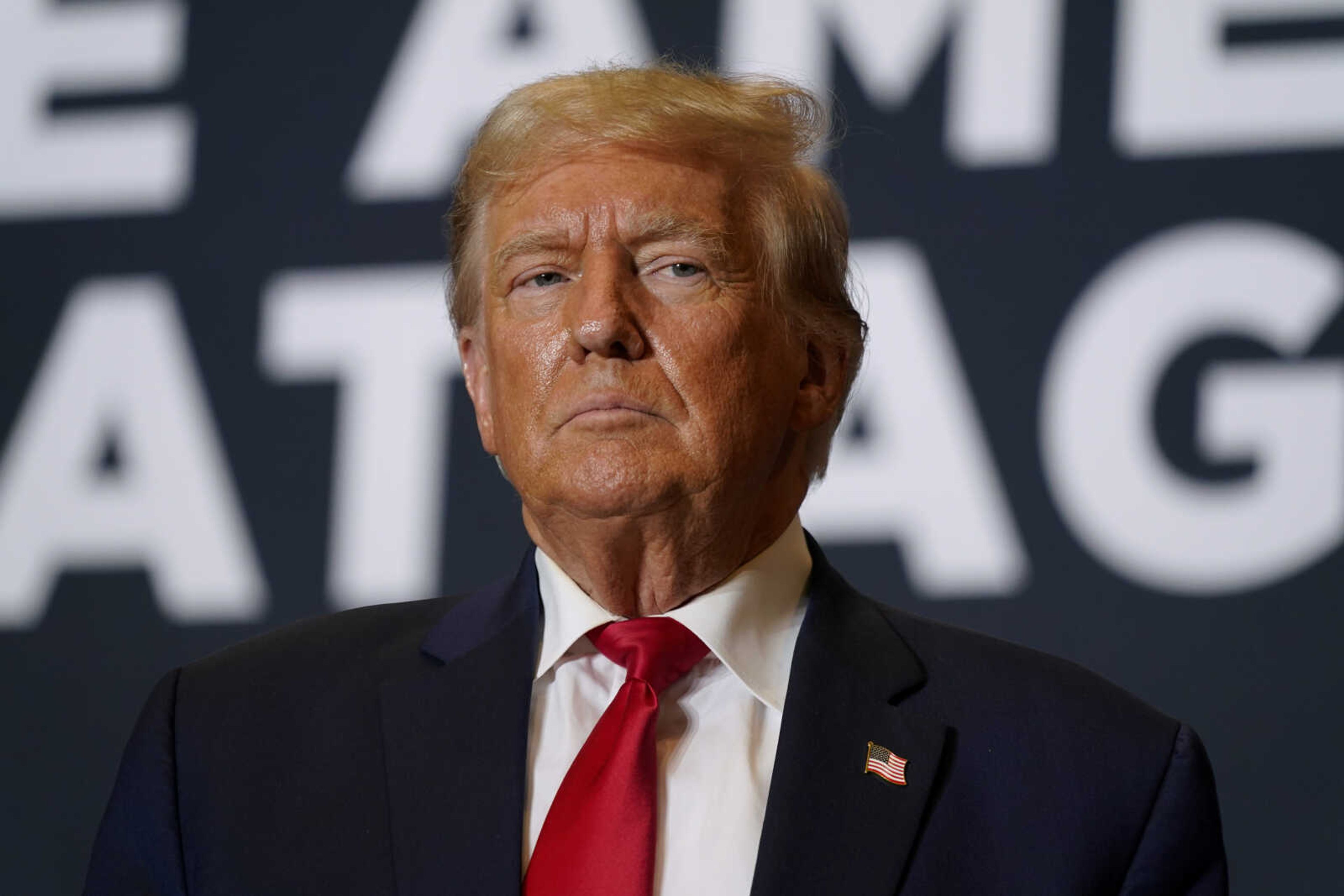 Former President Donald Trump arrives at a commit to caucus rally Oct. 7 in Cedar Rapids, Iowa.