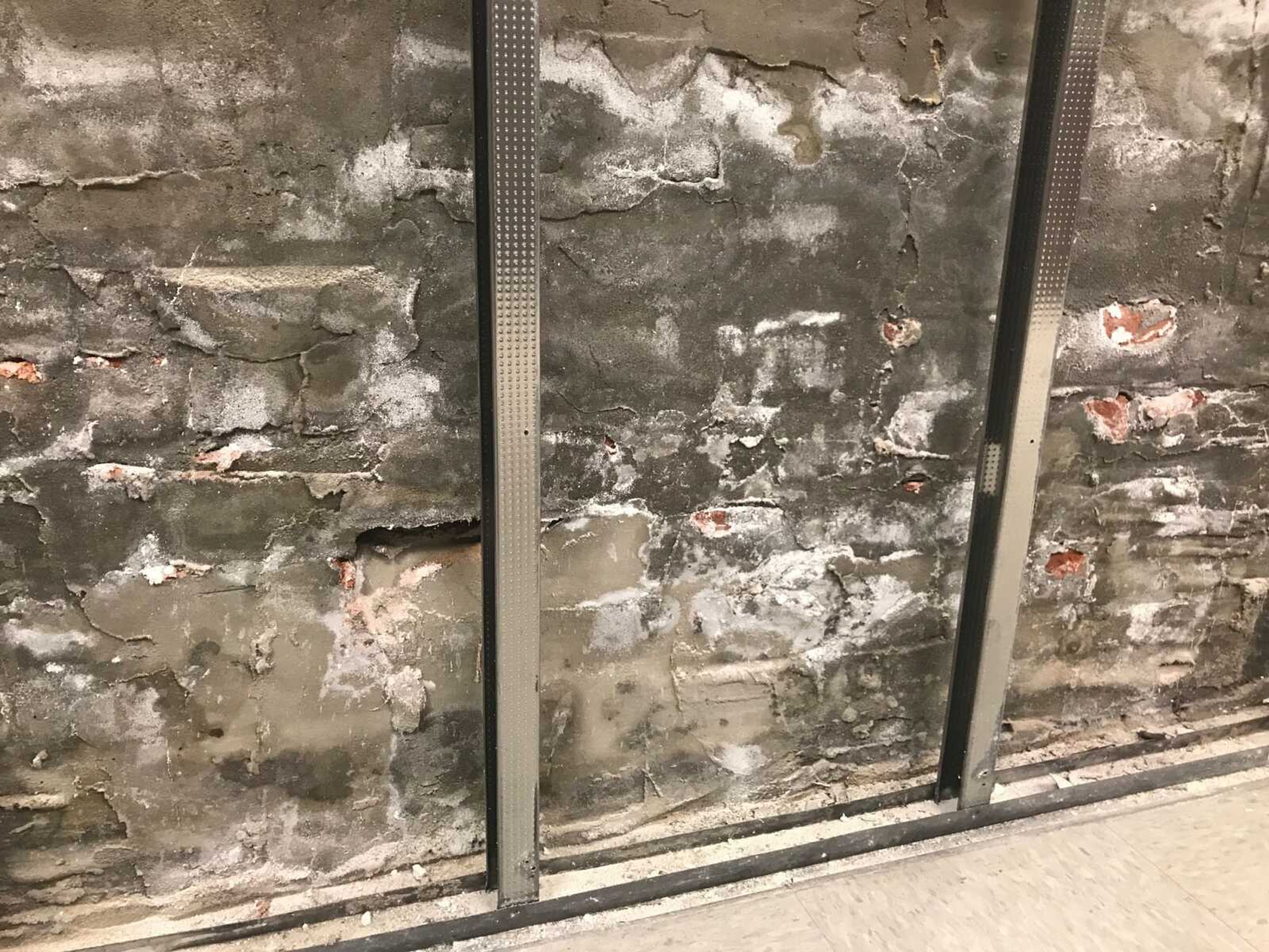 The wall behind the removed drywall in a hallway on the first floor of the Art Building is seen at Southeast Missouri State University.