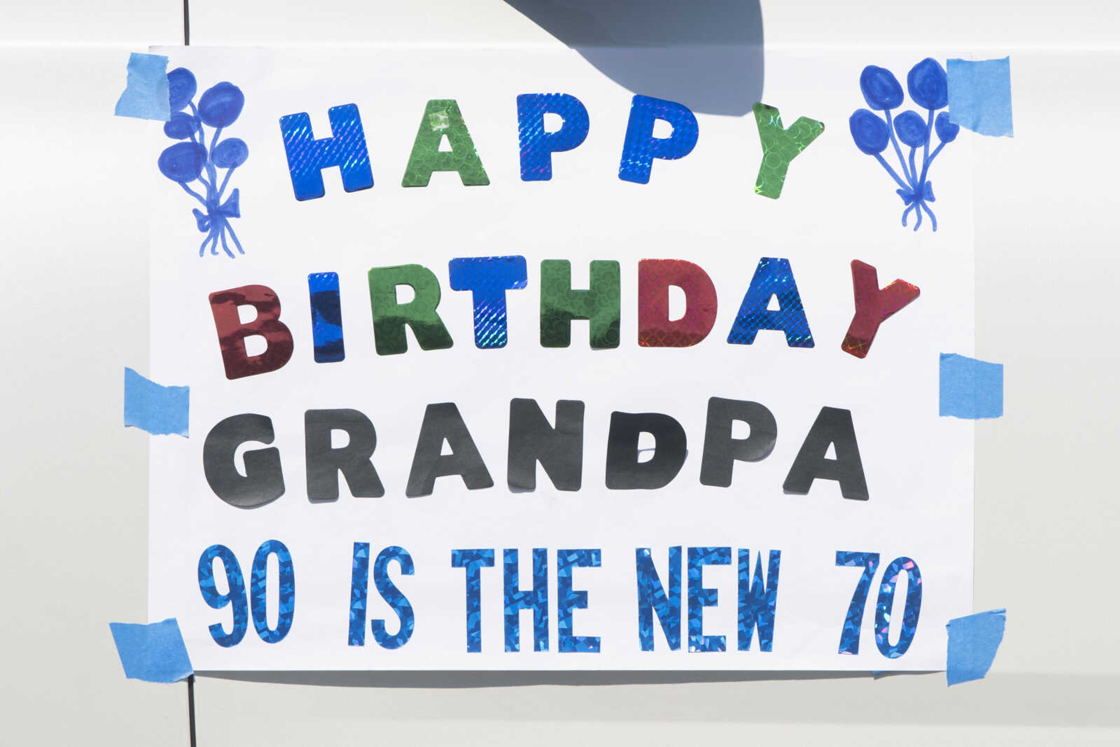 A birthday sign for the 90th birthday of Paul L. Essner of Benton, Missouri, is seen on a vehicle taking part in parade to celebrate Paul's birthday Saturday, April 18, 2020, along U.S. 61 in Benton, Missouri.