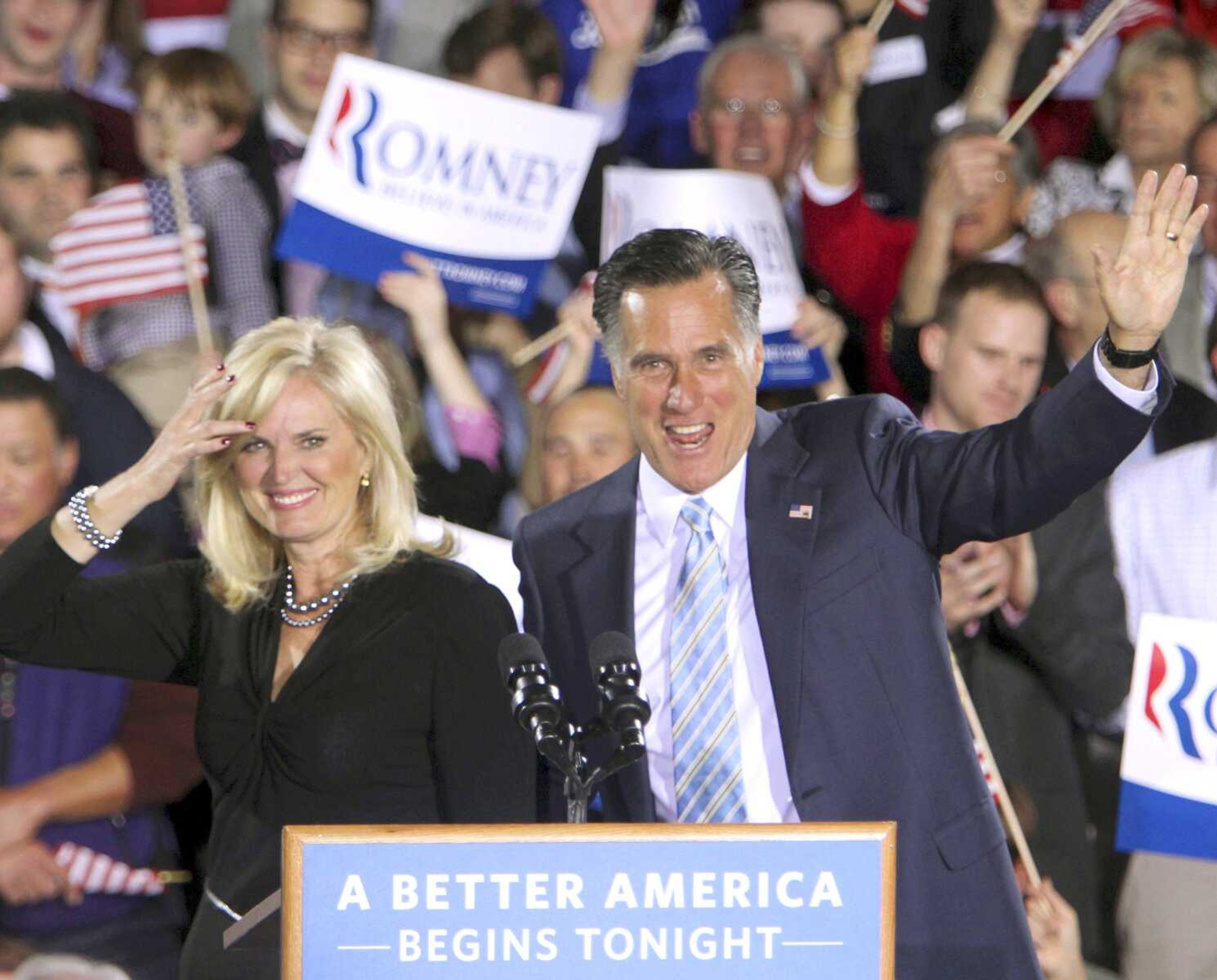 Republican presidential candidate Mitt Romney and his wife, Ann, wave to supporters Tuesday in Manchester, N.H. (Jim Cole ~ Associated Press)