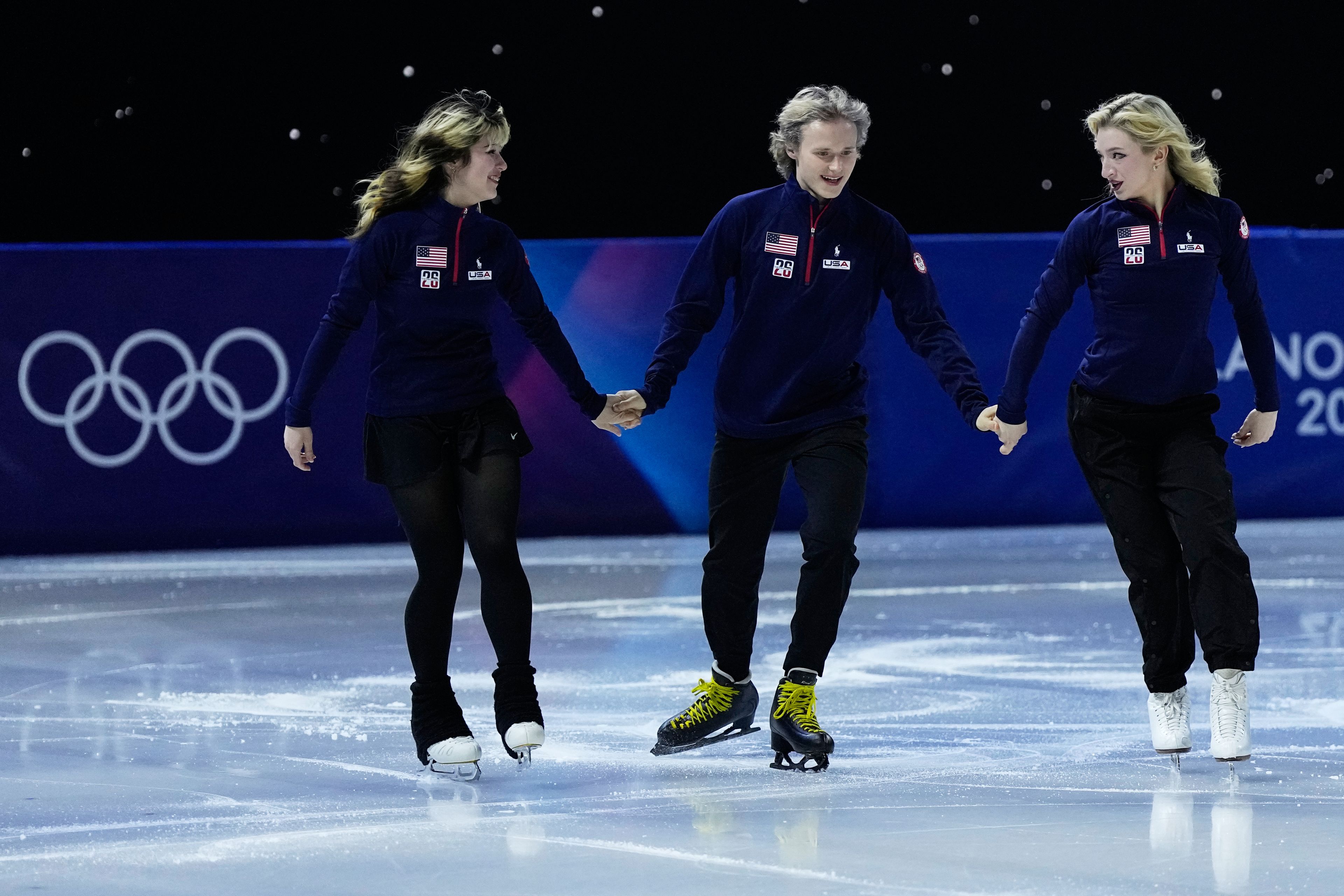 From left, Alysa Liu, Ilia Malinin and Amber Glenn of Team USA perform during the figure skating exhibition at the 2026 Winter Olympics, in Milan, Italy, Saturday, Feb. 21, 2026. (AP Photo/Ashley Landis)