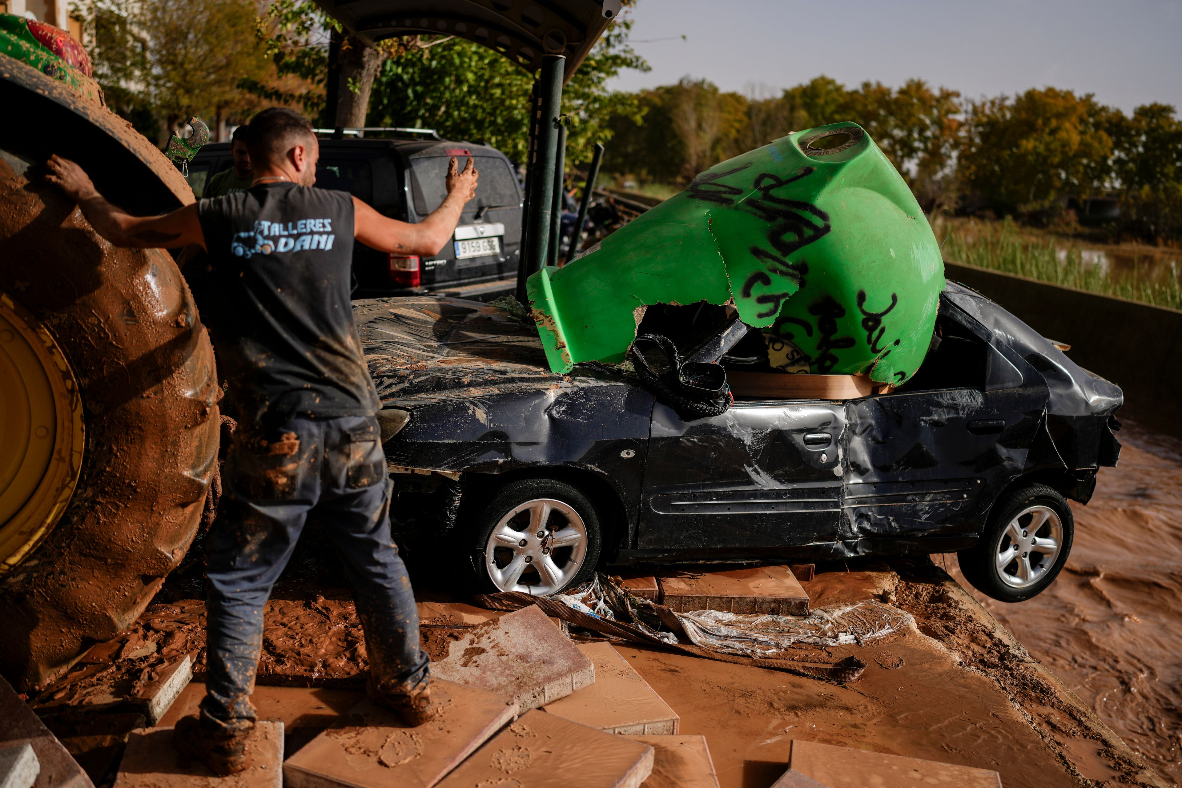 Flooded cars are piled up in Utiel, Spain, Wednesday, Oct. 30, 2024. (AP Photo/Manu Fernandez)