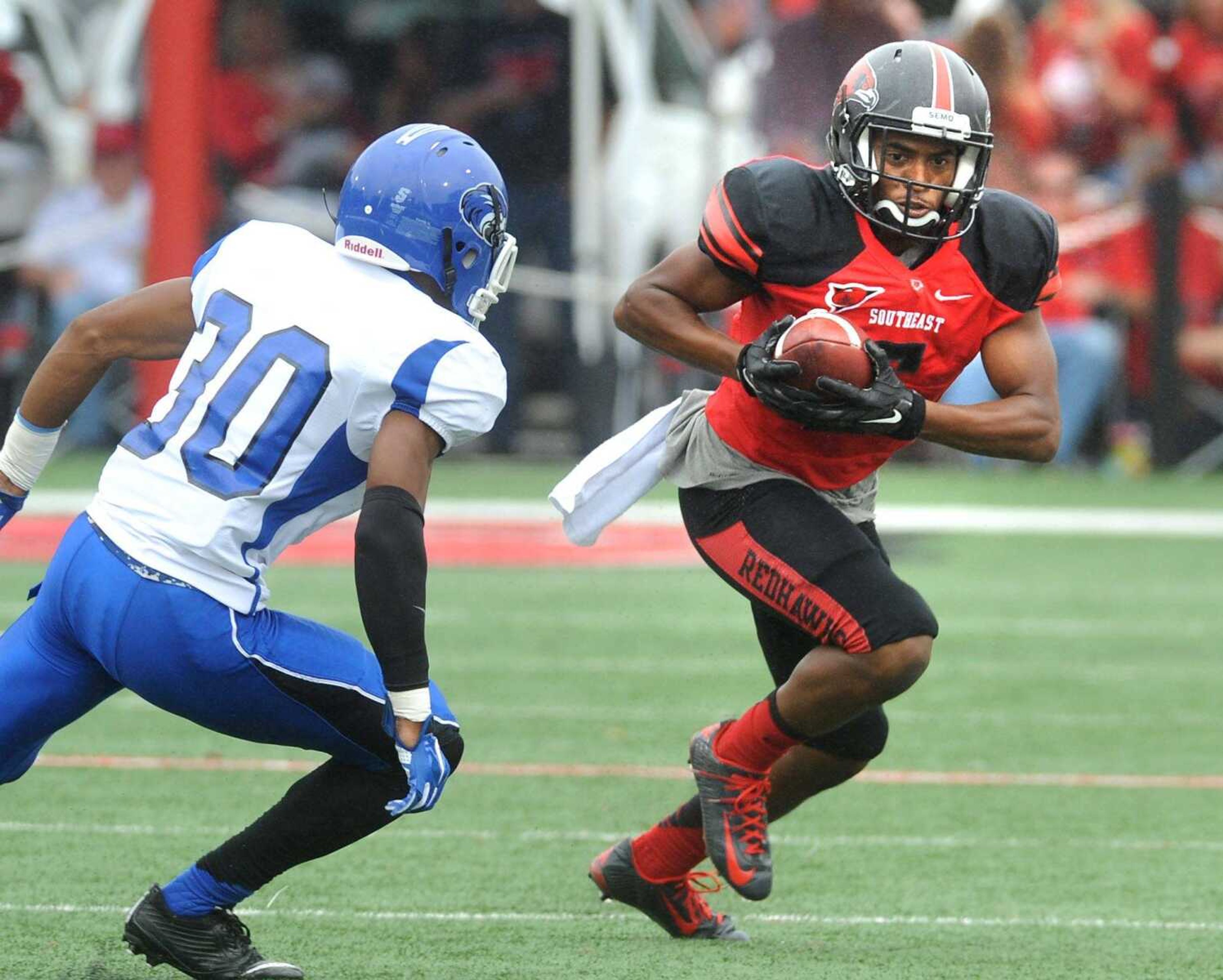 Southeast Missouri State's Darrius Darden-Box carries for 9 yards with Shorter's Kevin Knight in pursuit during the third quarter Saturday, Sept. 26, 2015 at Houck Stadium. (Fred Lynch)