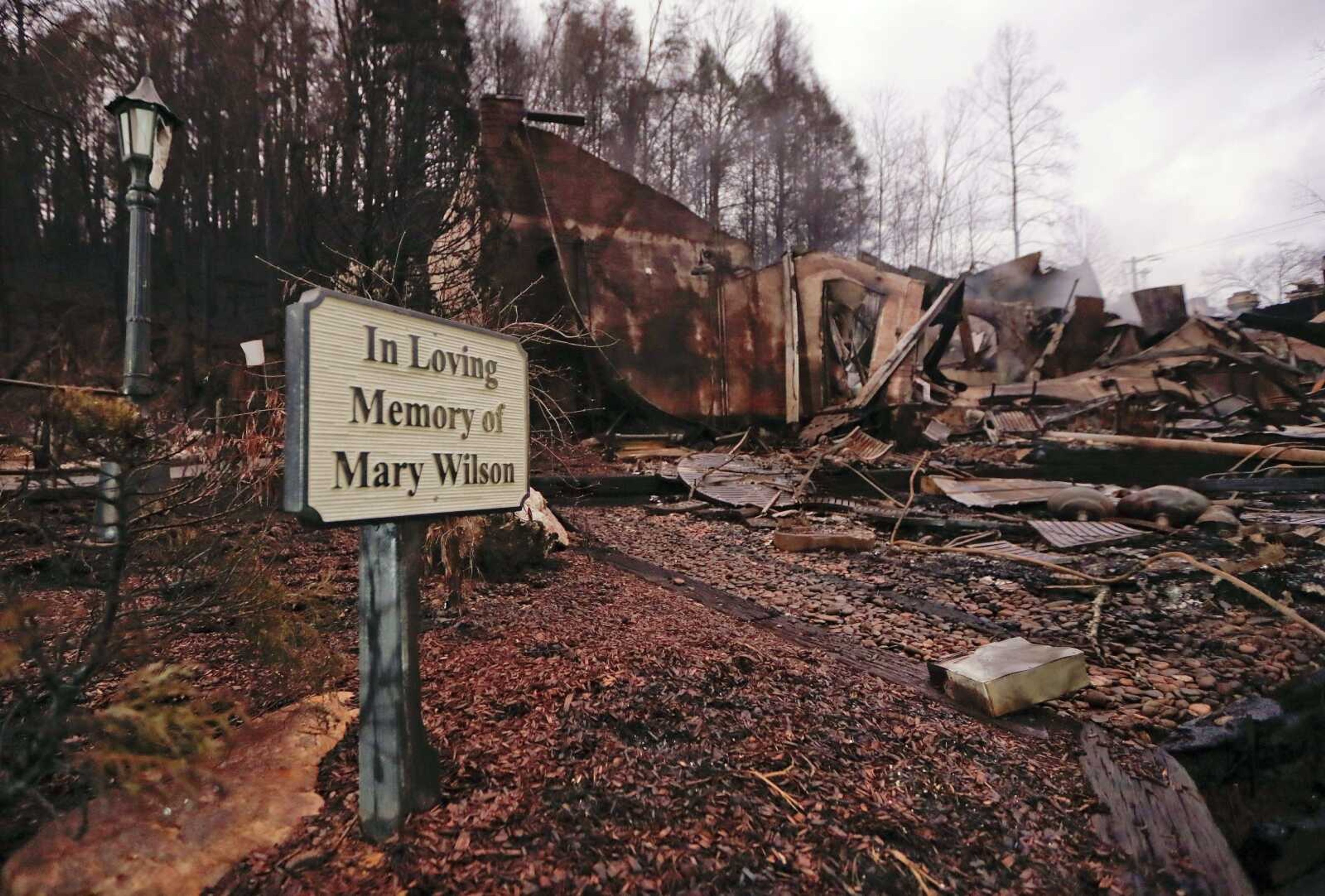 Smoke rises from the remains of the Alamo Steak House on Wednesday in Gatlinburg, Tennessee, after a wildfire swept through the area Monday. Three more bodies were found in the ruins of wildfires that torched hundreds of homes and businesses in the Great Smoky Mountains area, officials said Wednesday.