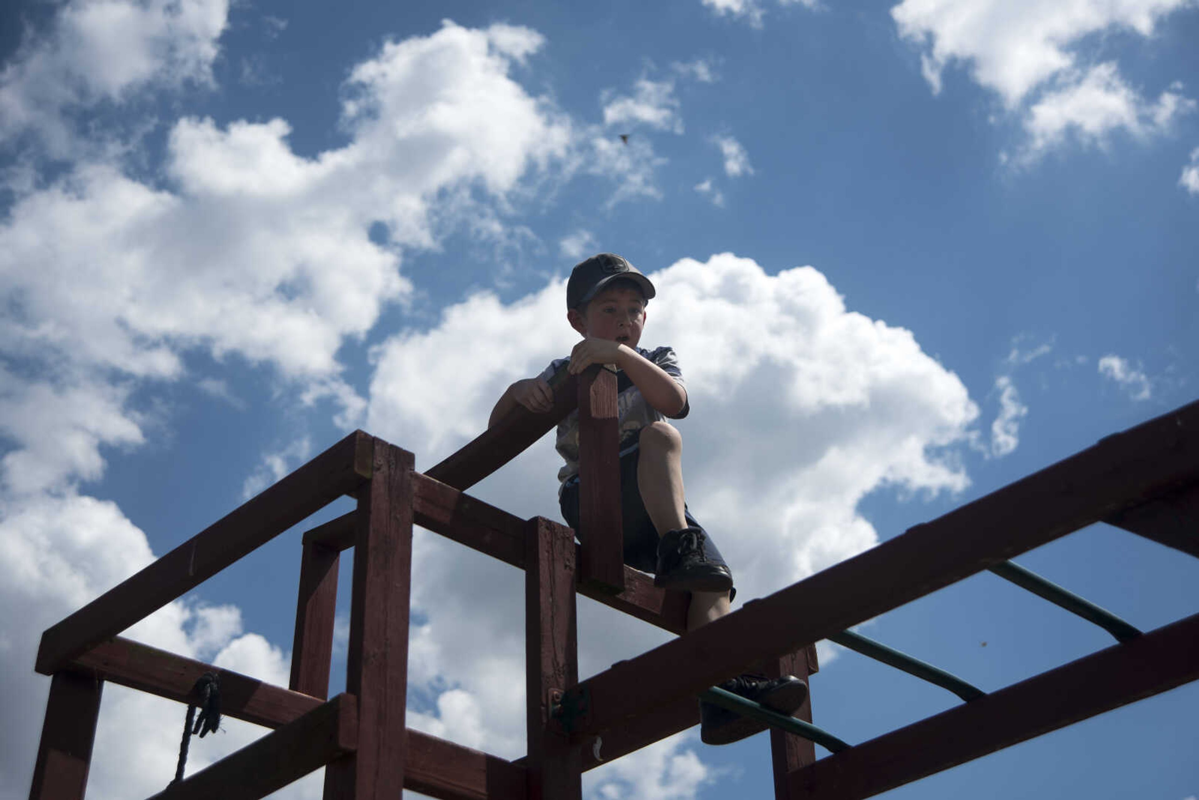 Charles Masegian III, 5, climbs on the playground during the Safari Egg Hunt Saturday, April 15, 2017 at Lazy L Safari Park in Cape Girardeau.