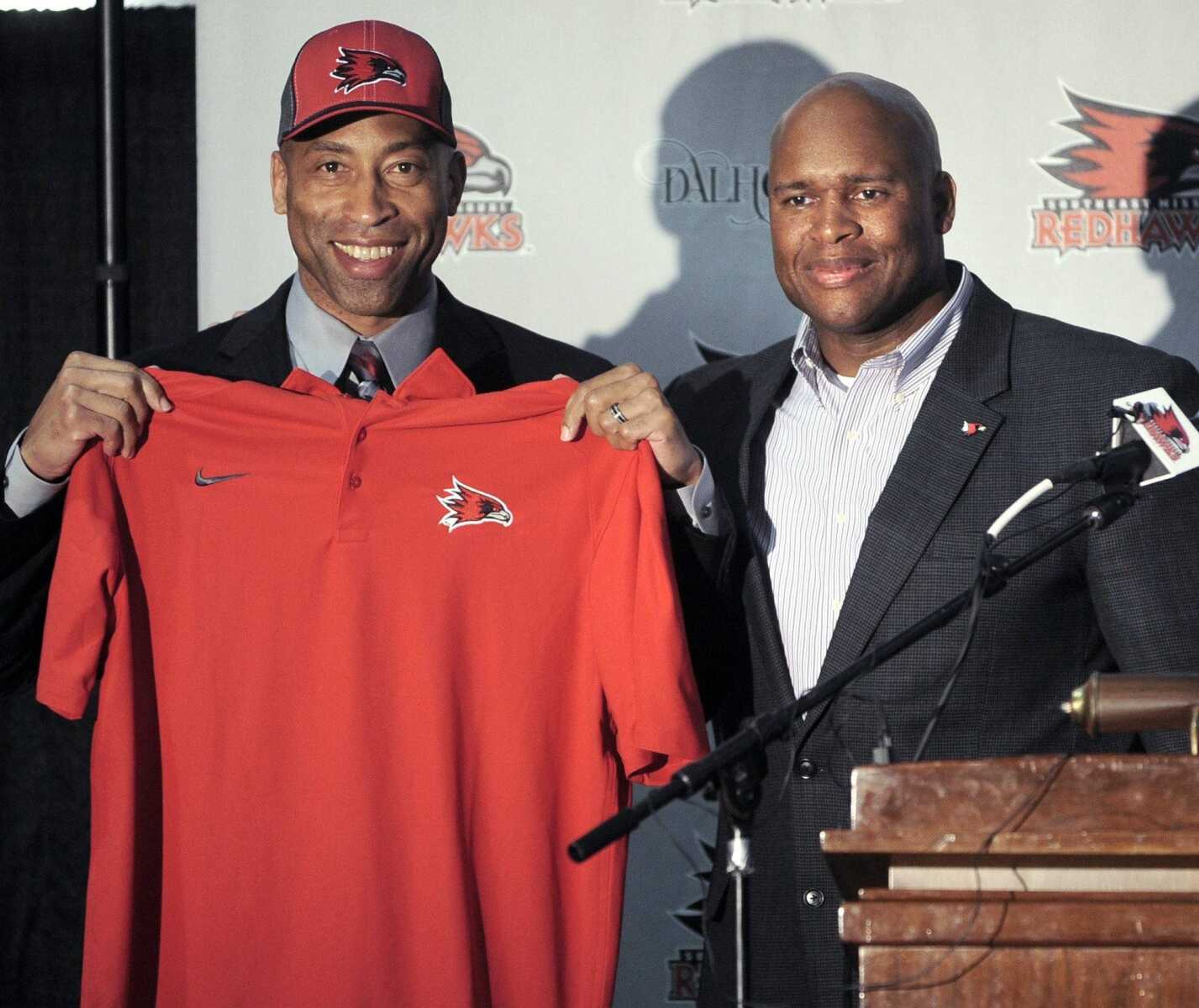 Rick Ray, left, is announced as new head basketball coach at Southeast Missouri State University by director of athletics Mark Alnutt, right, at a news conference Monday, April 13, 2015 at the Show Me Center. (Fred Lynch)