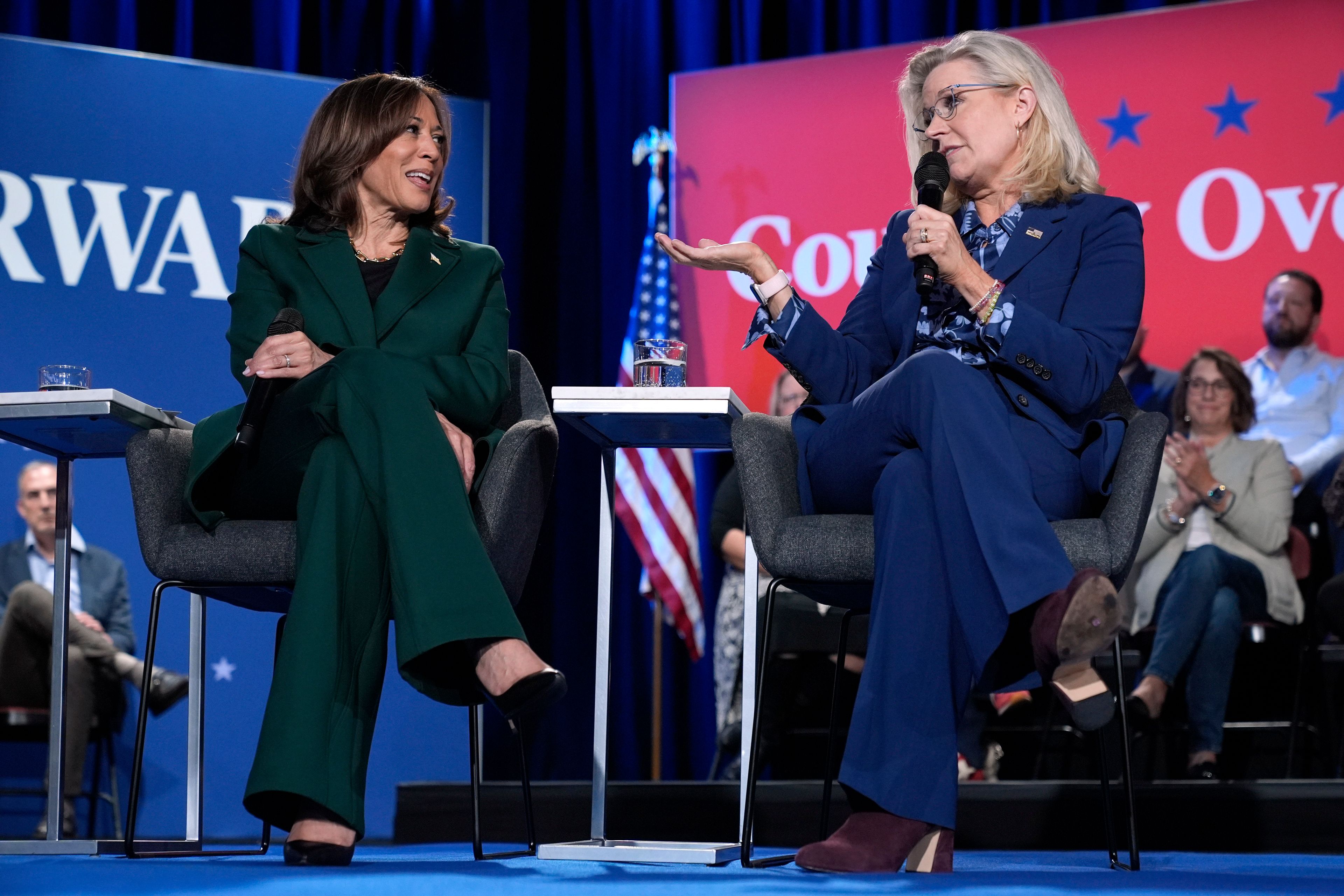 Former Republican Congresswoman Liz Cheney speaks as Democratic presidential nominee Vice President Kamala Harris listens during a town hall at the Royal Oak Theatre in Royal Oak, Mich., Monday, Oct. 21, 2024. (AP Photo/Jacquelyn Martin)