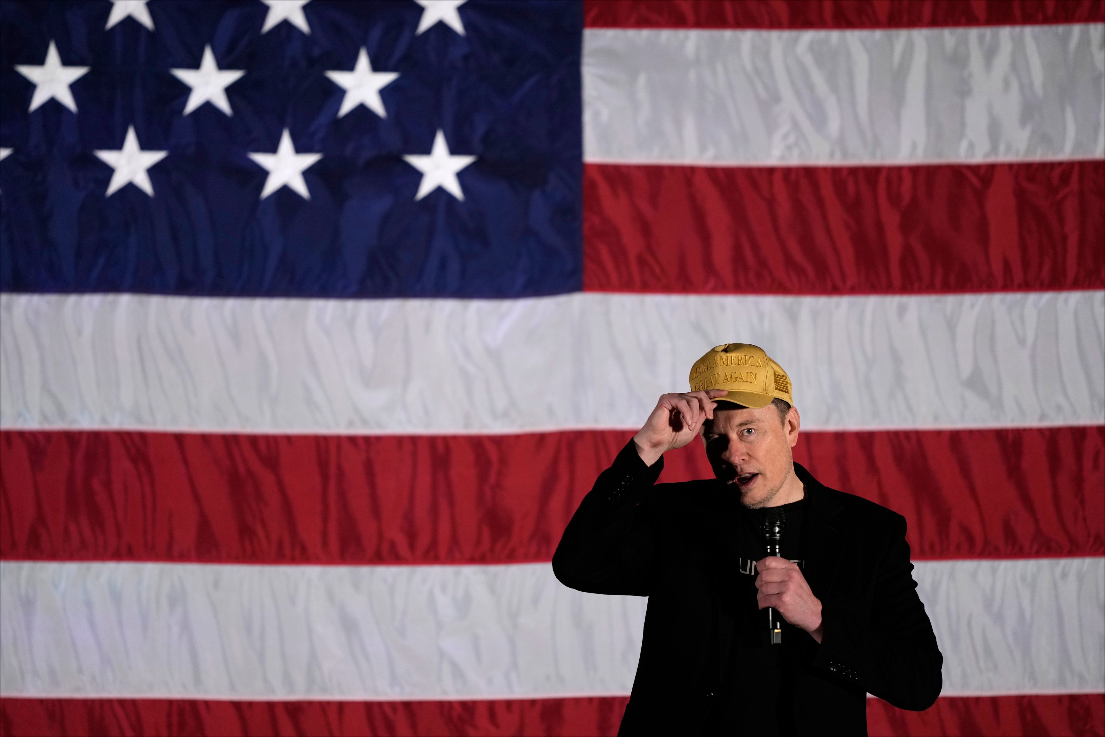 Elon Musk speaks as part of a campaign town hall in support of Republican presidential nominee former President Donald Trump in Folsom, Pa., Thursday, Oct. 17, 2024. (AP Photo/Matt Rourke)