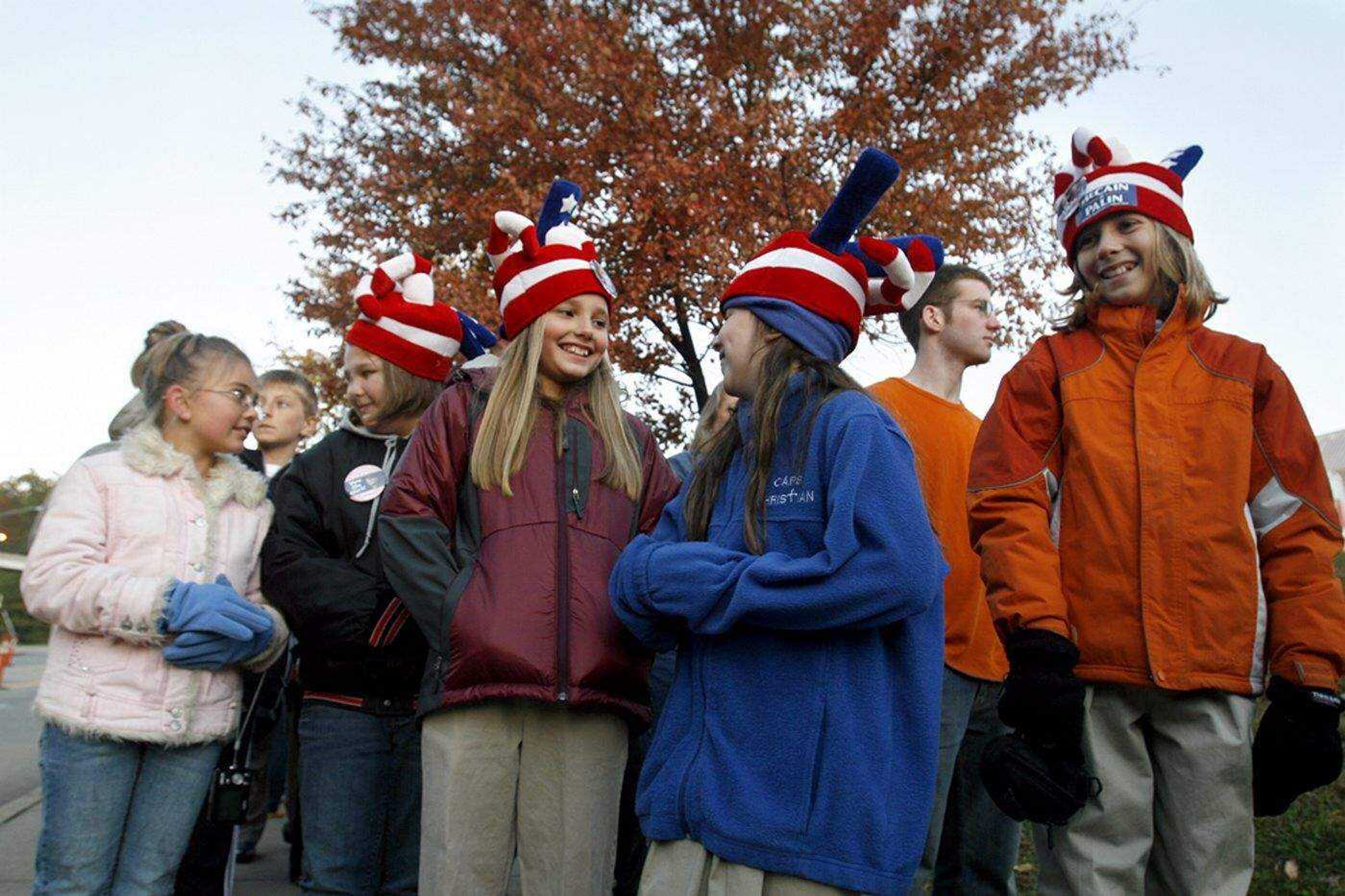 ELIZABETH DODD ~ edodd@semissourian.com
Audrey Keller, from left, Jenny Keller, both of Sikeston, Peyton Outman, Caitlyn Limbaugh and Parker Outman, of Cape Girardeau sport hats they got from Goodwill to show their support for Sarah Palin at the Show Me Center Thursday.