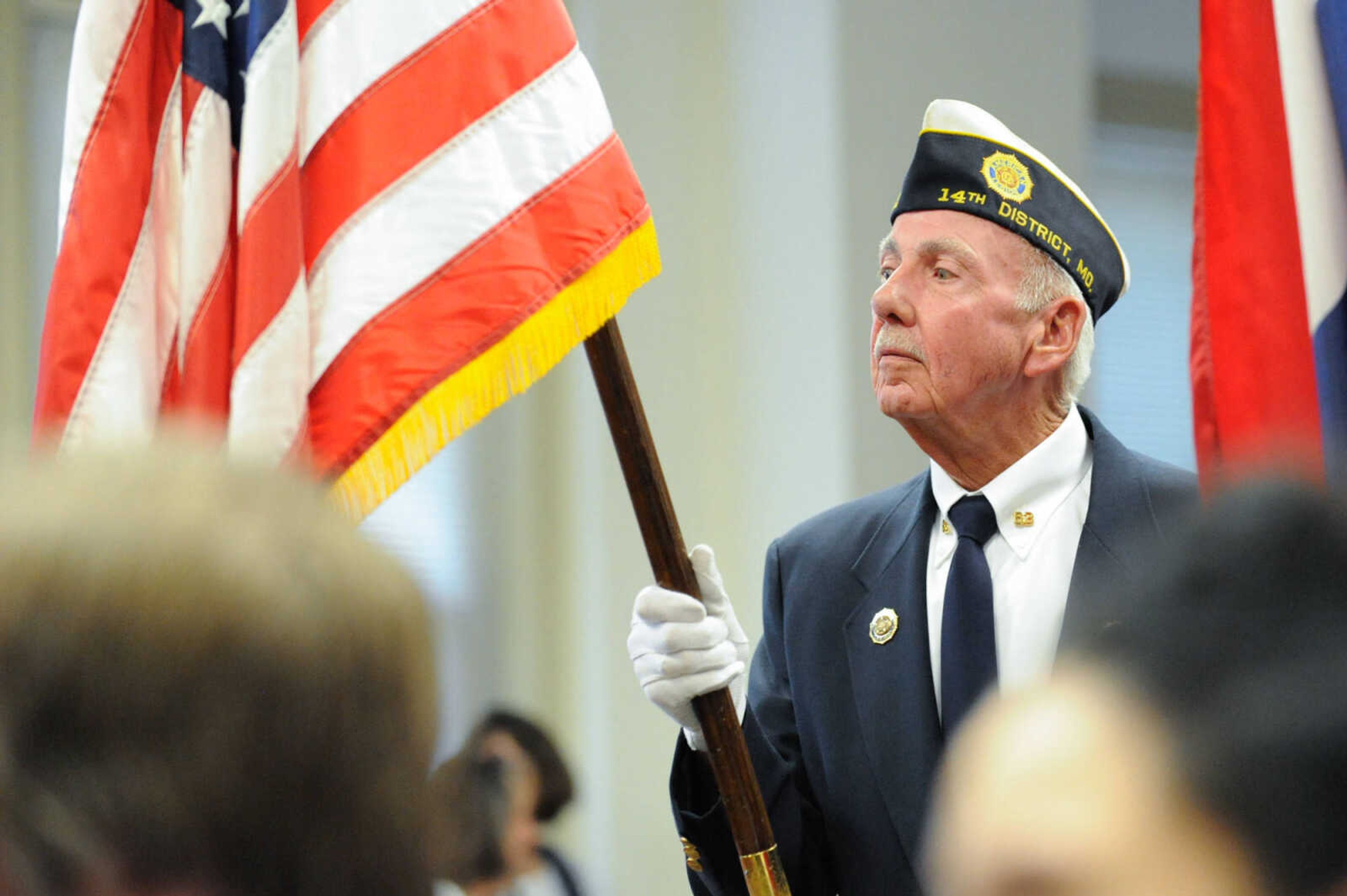 GLENN LANDBERG ~ glandberg@semissourian.com

A member of American Legion Post No. 63 presents the Flag during a naturalization ceremony Monday, July 4, 2016 at the Common Pleas Courthouse in Cape Girardeau.