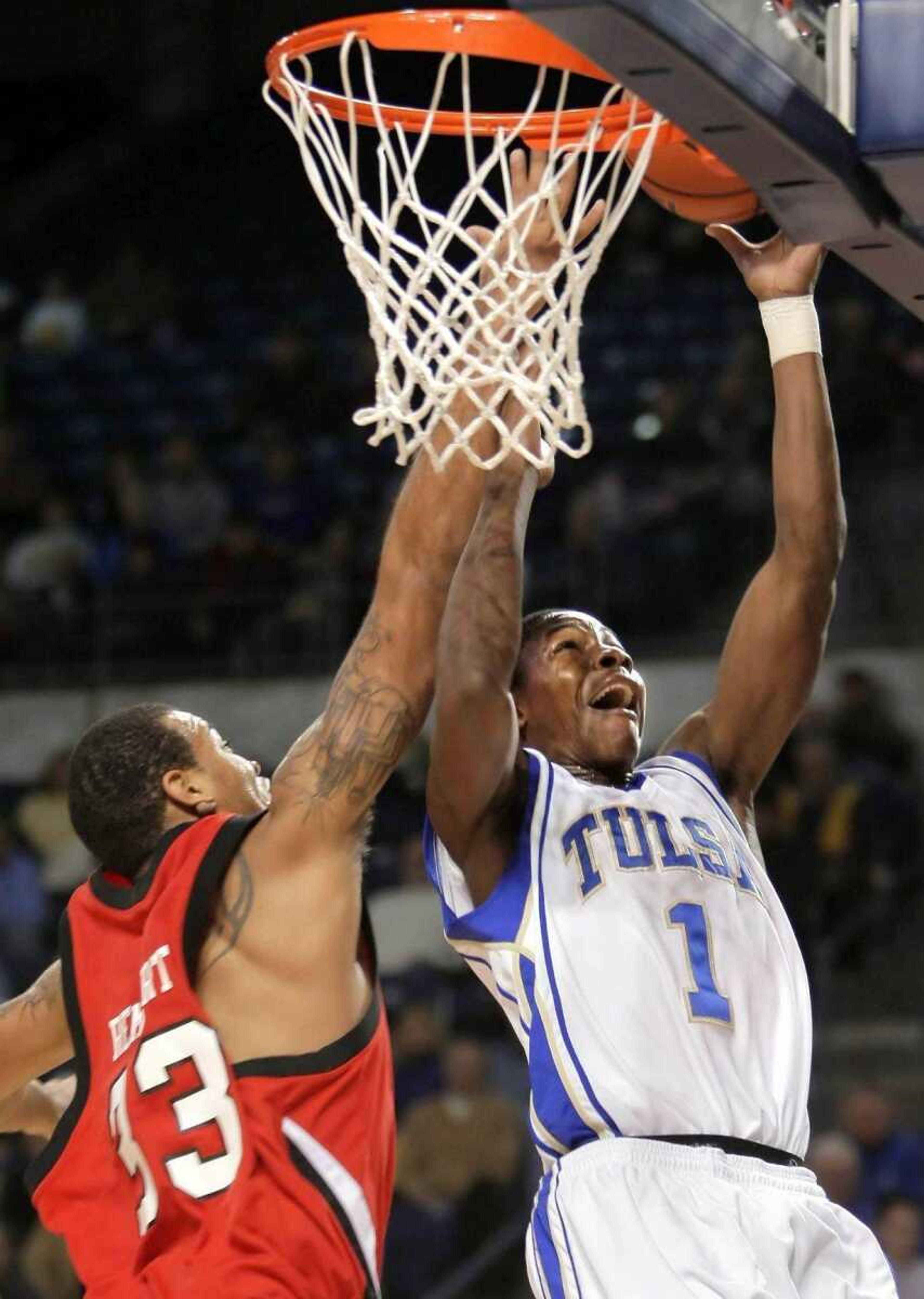 Tulsa's Ben Uzoh put up a shot past Southeast Missouri State's Mike Rembert during their game Saturday in Tulsa, Okla. (MICHAEL WYKE ~ Tulsa World)