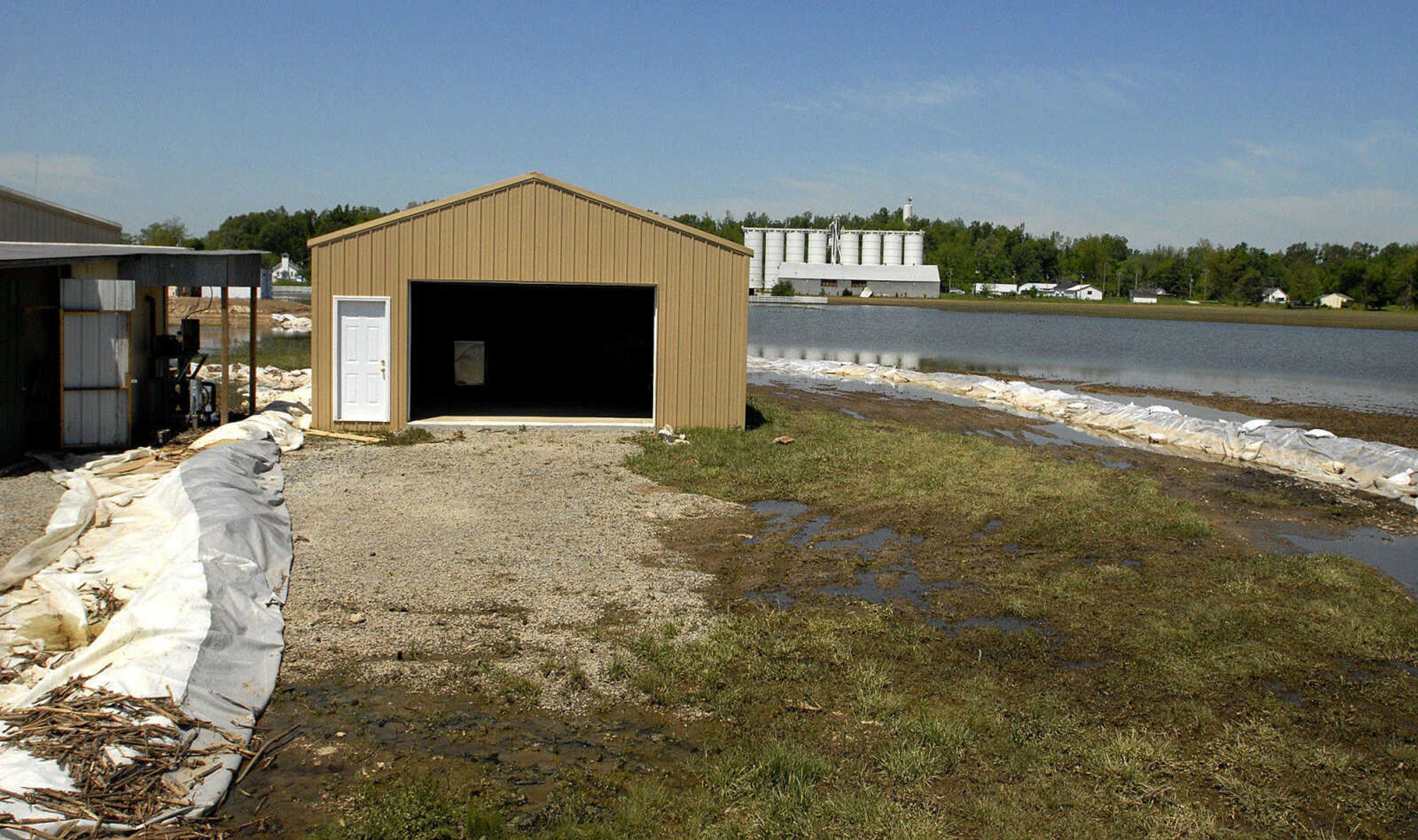 LAURA SIMON~lsimon@semissourian.com
Floodwaters in Olive Branch, Ill. have receded leaving behind a row of sandbags and debris such as corn husks from nearby farmland.