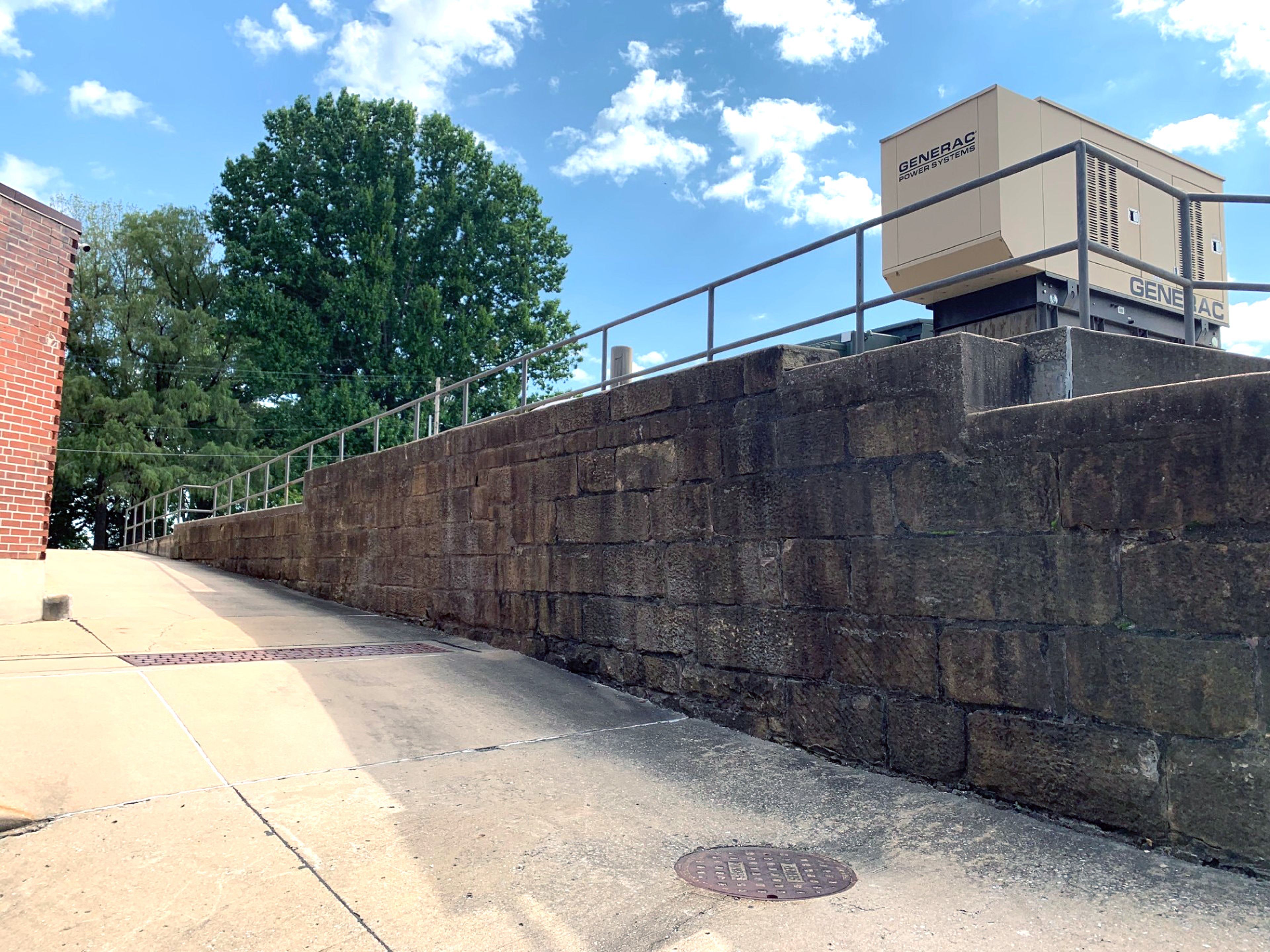 This retaining wall south of the Missourian Building was the creation of skilled stonemasons Louis Brinkopf and Charles Bock in 1924.