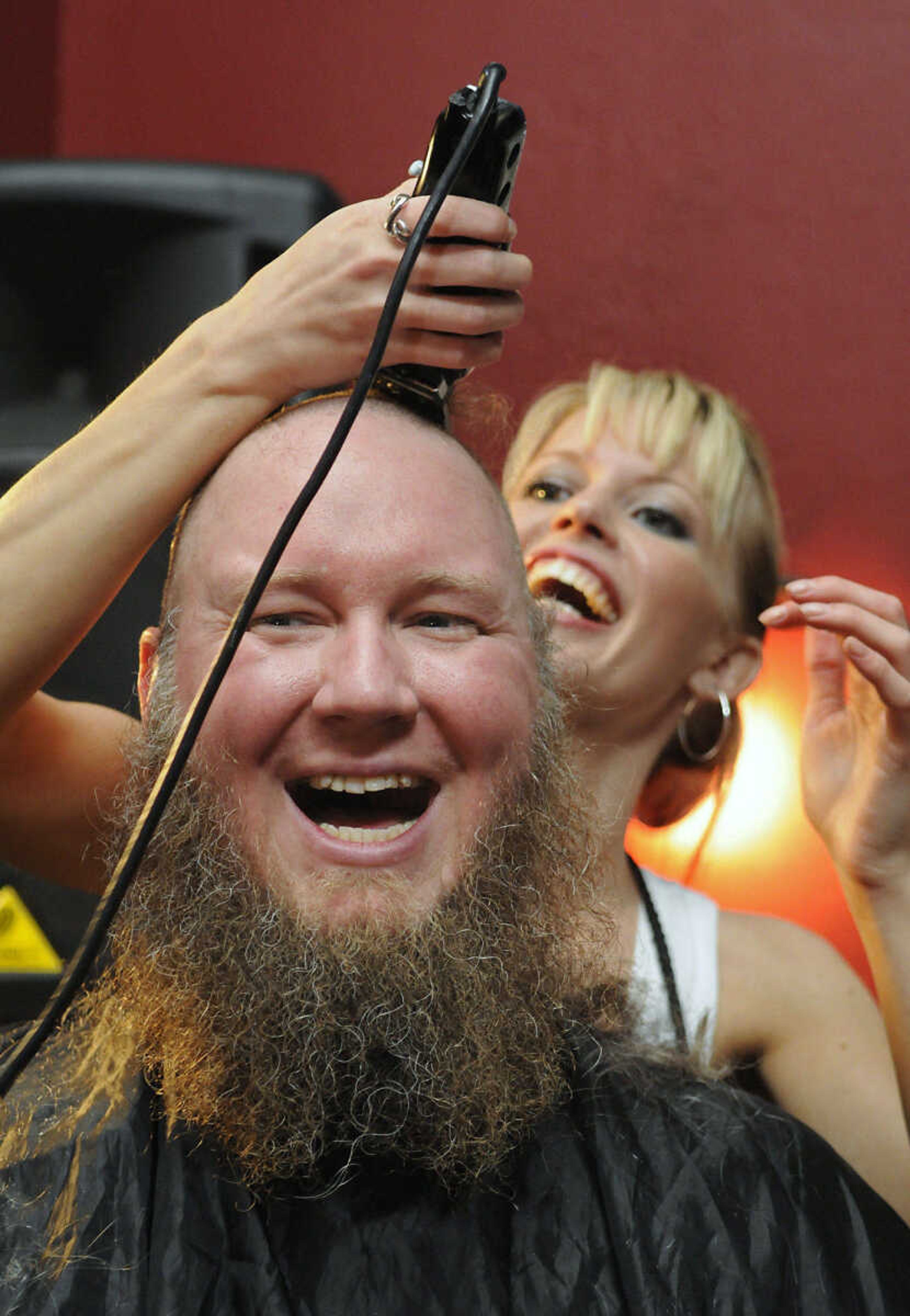 KRISTIN EBERTS ~ keberts@semissourian.com

Mike Mills parts with his hair during the St. Baldrick's event at Buckner Brewing Company in Cape Girardeau, Mo., on Saturday, April 24, 2010. Mills was a member of a team made up of Buckner employees that raised $4,166 as a group. The twenty-five area participants in the event raised over $9,000 collectively before shaving their heads in front of family and friends to benefit the St. Baldrick's Foundation for child cancer research.