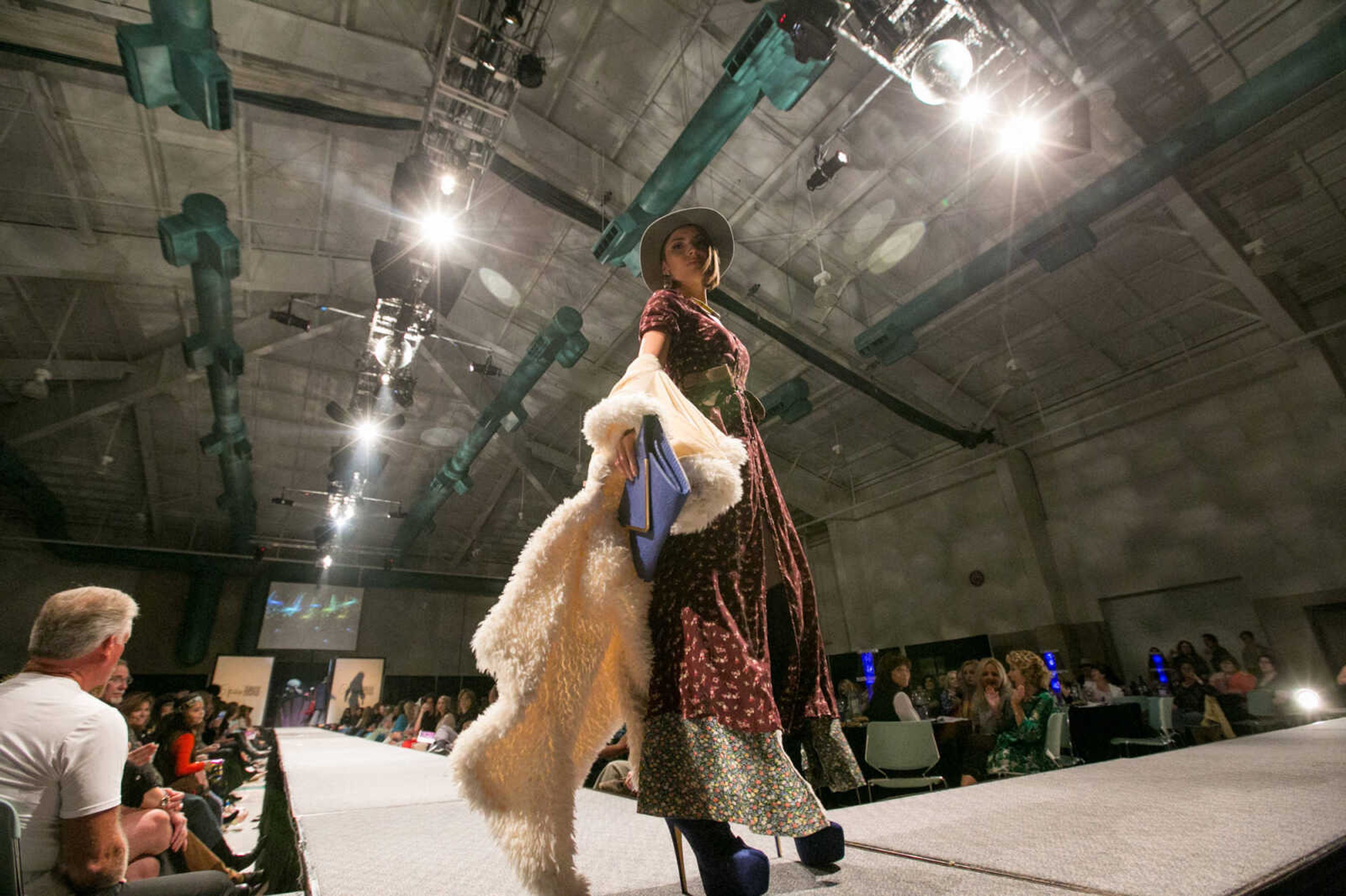 GLENN LANDBERG ~ glandberg@semissourian.com


Violet Owen turns at the end of runway during the VintageNOW fashion show at the Osage Centre on Saturday, October 24, 2015. Proceeds benefited the Safe House for Women.