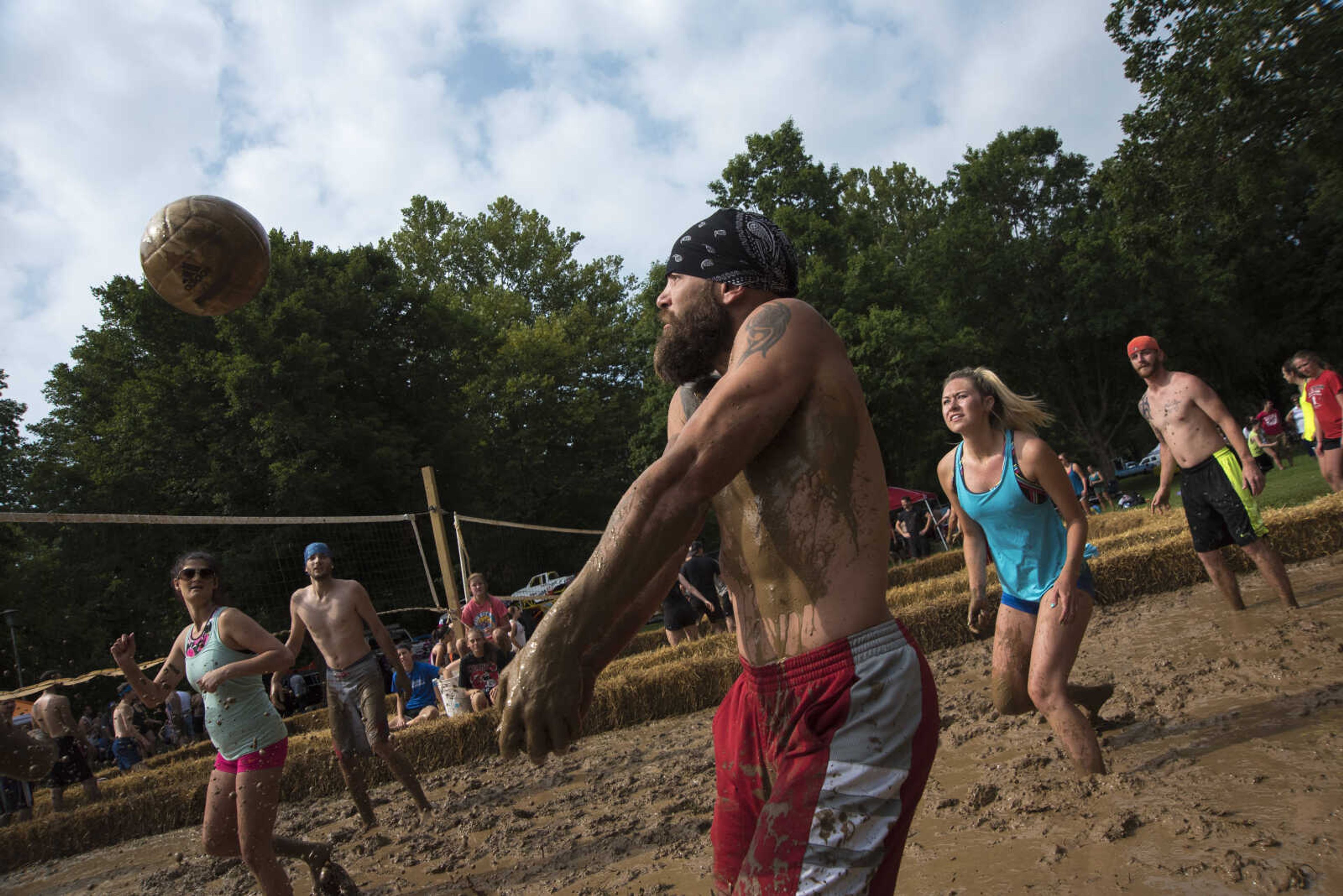 Jimmy Sievers hits the ball during mud volleyball for the Jackson Parks and Recreation's July 4th celebration Tuesday, July 4, 2017 in Jackson City Park.