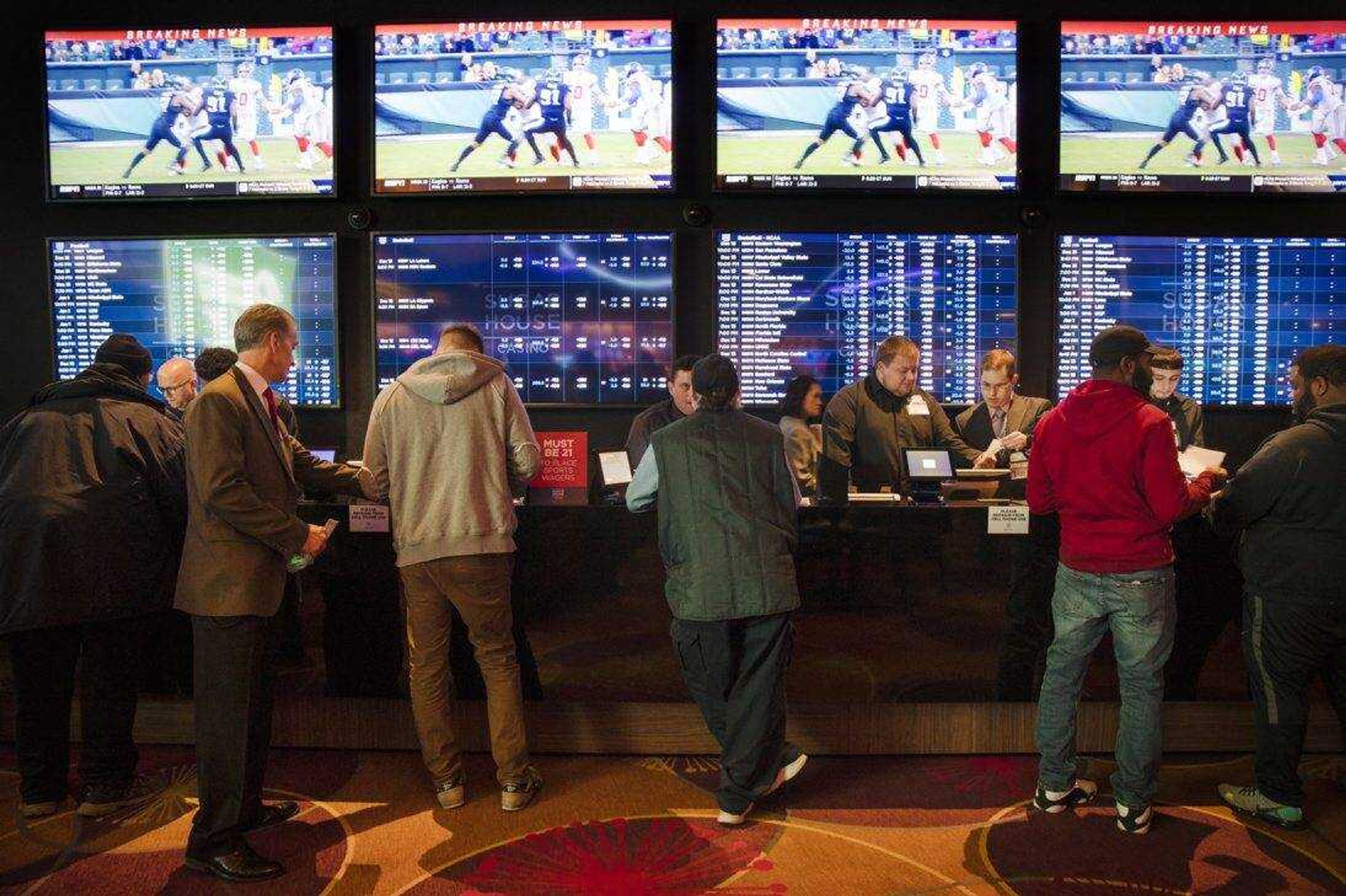 Gamblers place bets in the temporary sports betting area at the SugarHouse Casino in Philadelphia. Most of the states moving quickly to legalize sports after a Supreme Court decision last year, including Pennsylvania, are still waiting for the expected payoff.