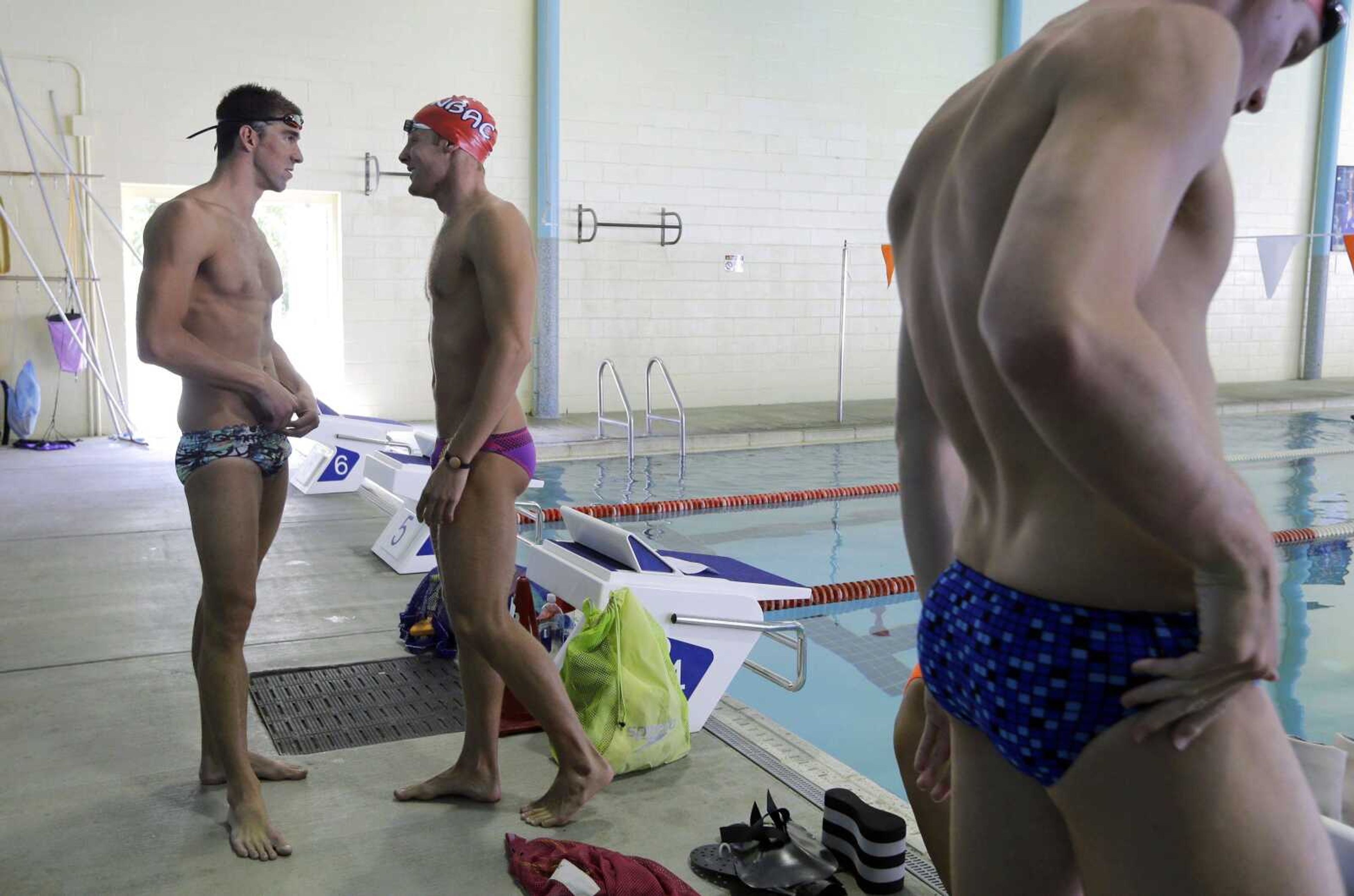 Phelps, left, chats with a fellow swimmer before a training session at Meadowbrook Aquatic and Fitness Center on July 31 in Baltimore. (Patrick Semansky ~ Associated Press)