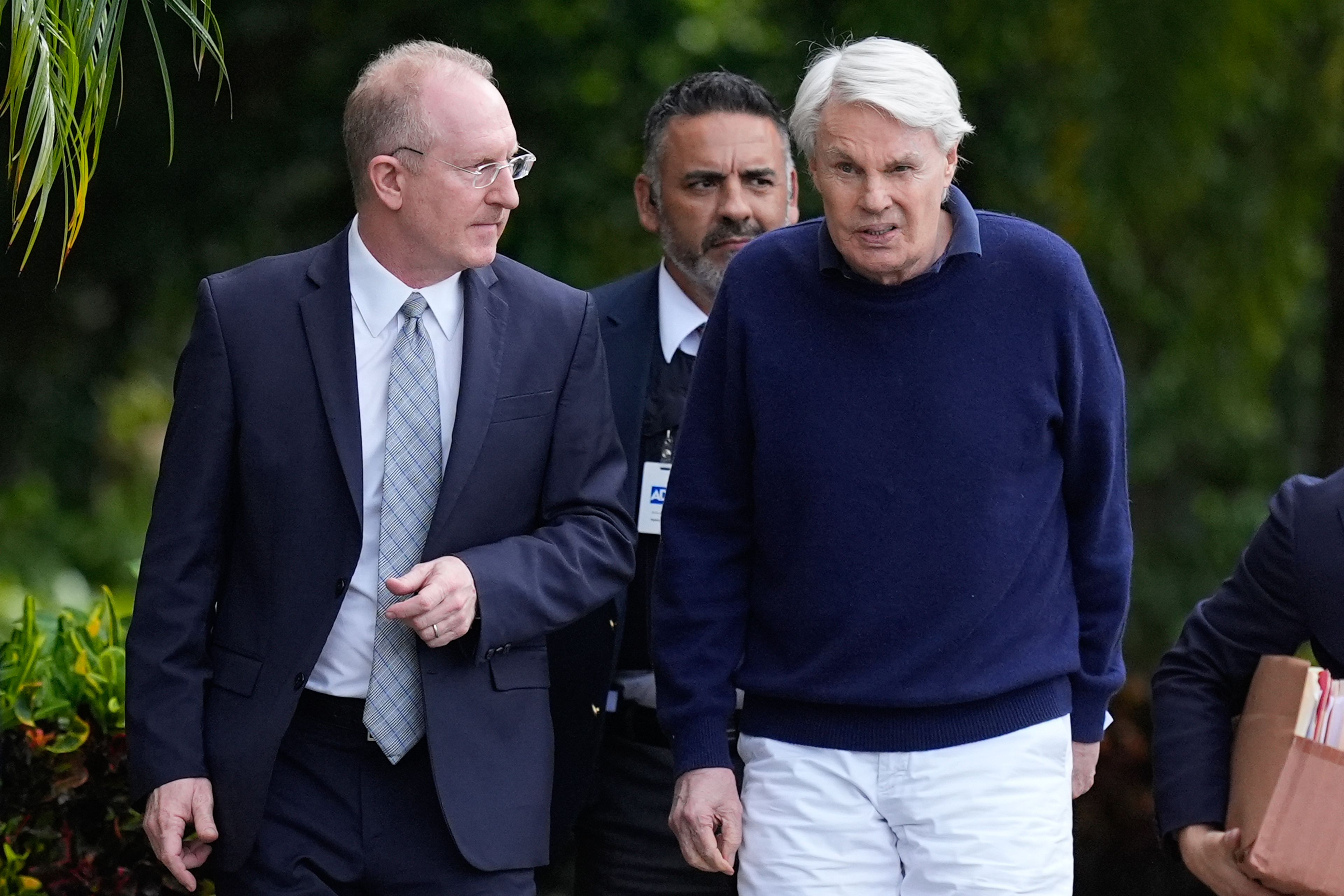 Michael Jeffries, right, former CEO of Abercrombie & Fitch, leaves with his attorney Brian Bieber following a hearing at the Paul G. Rogers Federal Building and U.S. Courthouse, in West Palm Beach, Fla., Tuesday, Oct. 22, 2024. (AP Photo/Rebecca Blackwell)