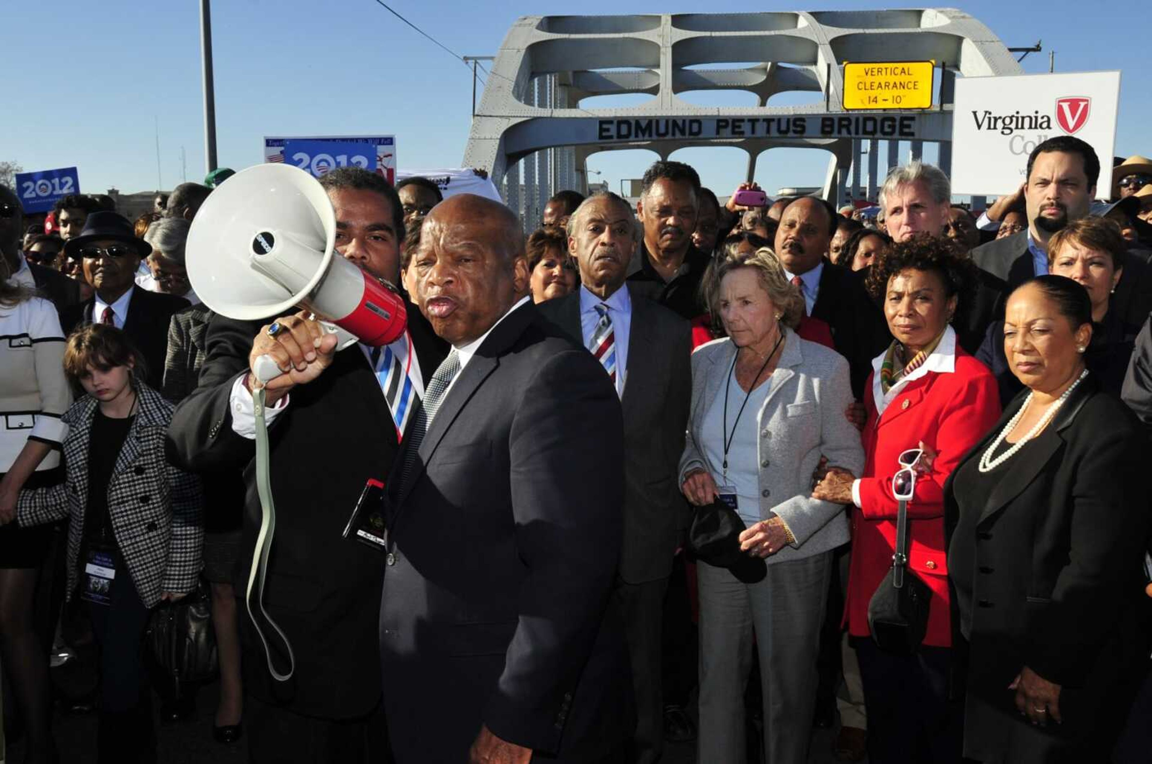 U.S. Rep. John Lewis, D-Ga., center, talks with those gathered on the historic Edmund Pettus Bridge on March 4, 2012, during the 19th annual reenactment of the "Bloody Sunday" Selma to Montgomery civil rights march across the bridge in Selma, Alabama. The Selma Bridge Crossing Jubilee on Sunday was the first without the towering presence of Lewis, as well as the Rev. Joseph Lowery, the Rev. C.T. Vivian and attorney Bruce Boynton, who all died in 2020.