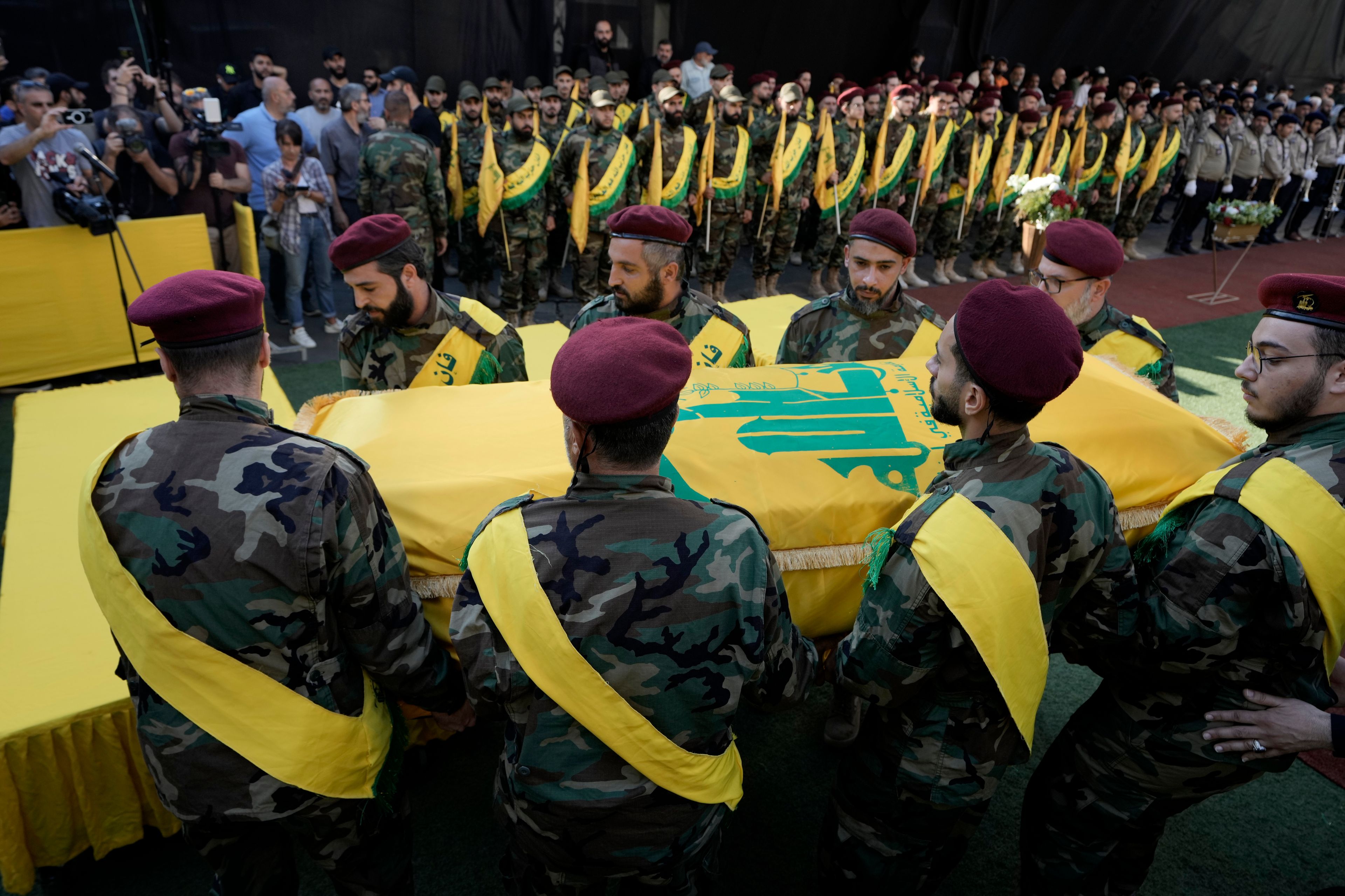 Hezbollah members carry the coffin of Hezbollah drone commander, Mohammed Hussein Surour, during his funeral procession in Beirut's southern suburbs, Friday, Sept. 27, 2024. (AP Photo/Bilal Hussein)