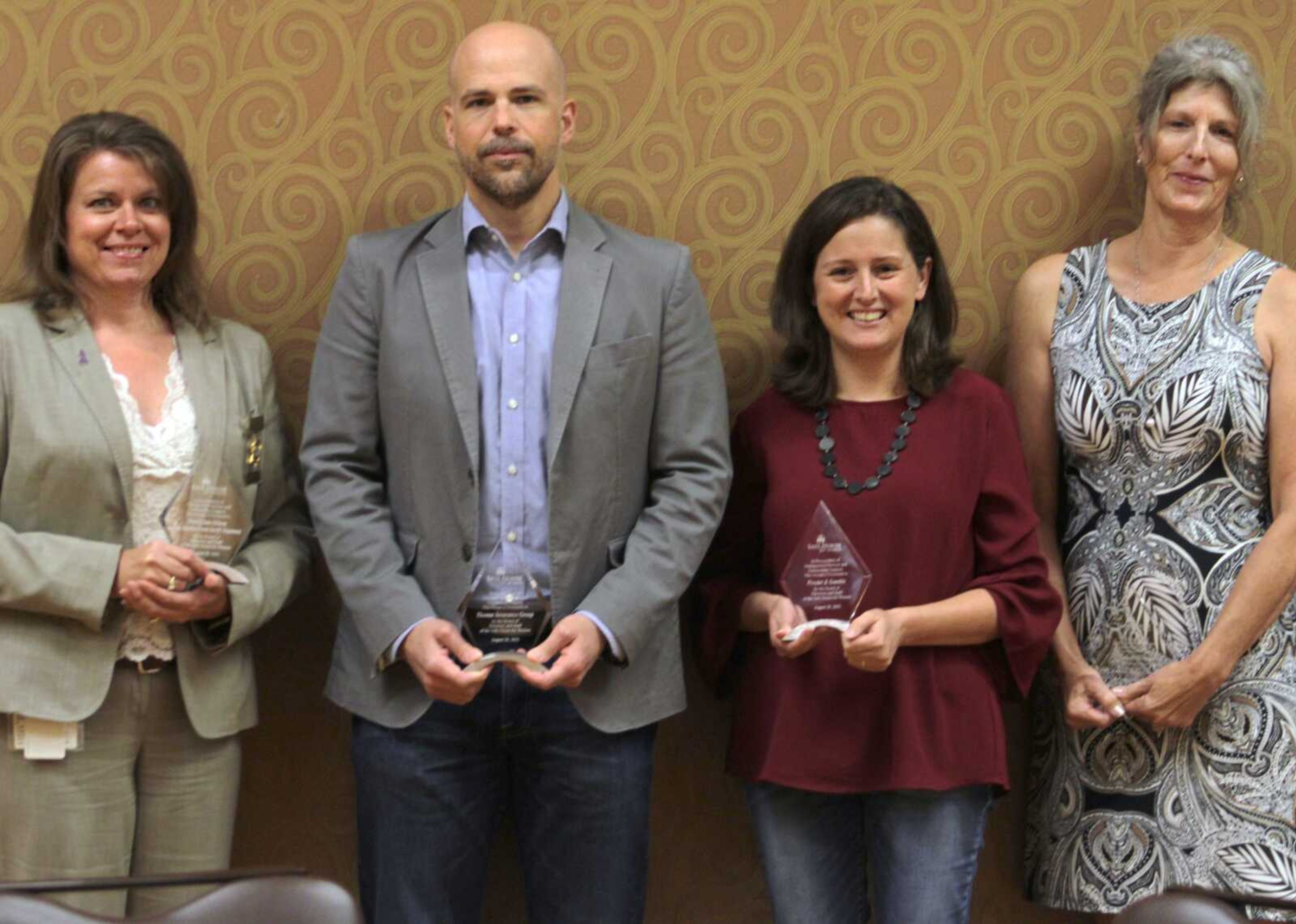 Recipients of Distinguished Service Awards from the Safe House for Women were Jaime Holloway with the Cape Girardeau County Sheriff's Office, Charley Tinsley with Thomas Insurance Group, Kim Lynch with Procter & Gamble and Elizabeth Hileman, who is director of the Safe House Thrift Shop, at the not-for-profit's 2021 luncheon and awards ceremony Friday at the Century Casino Event Center in Cape Girardeau. The Community Counseling Center Emergency Room Enhancement Program also received the award.