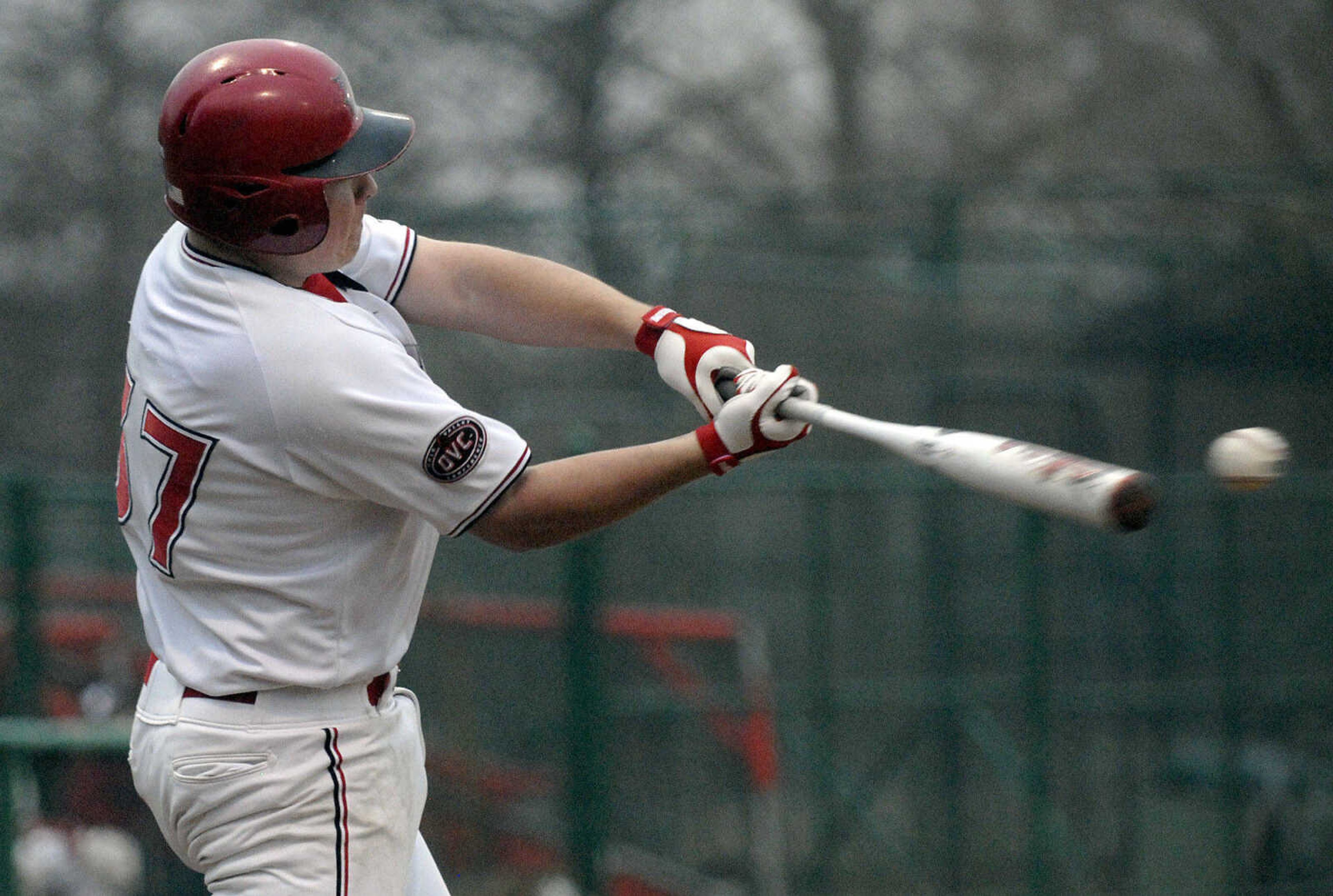 LAURA SIMON~lsimon@semissourian.com
Southeast senior Casey Jones digs into the ball for a single in the fifth inning against Ball State Sunday, February 27, 2011 at Capaha Field. Southeast defeated Ball State 22-8.