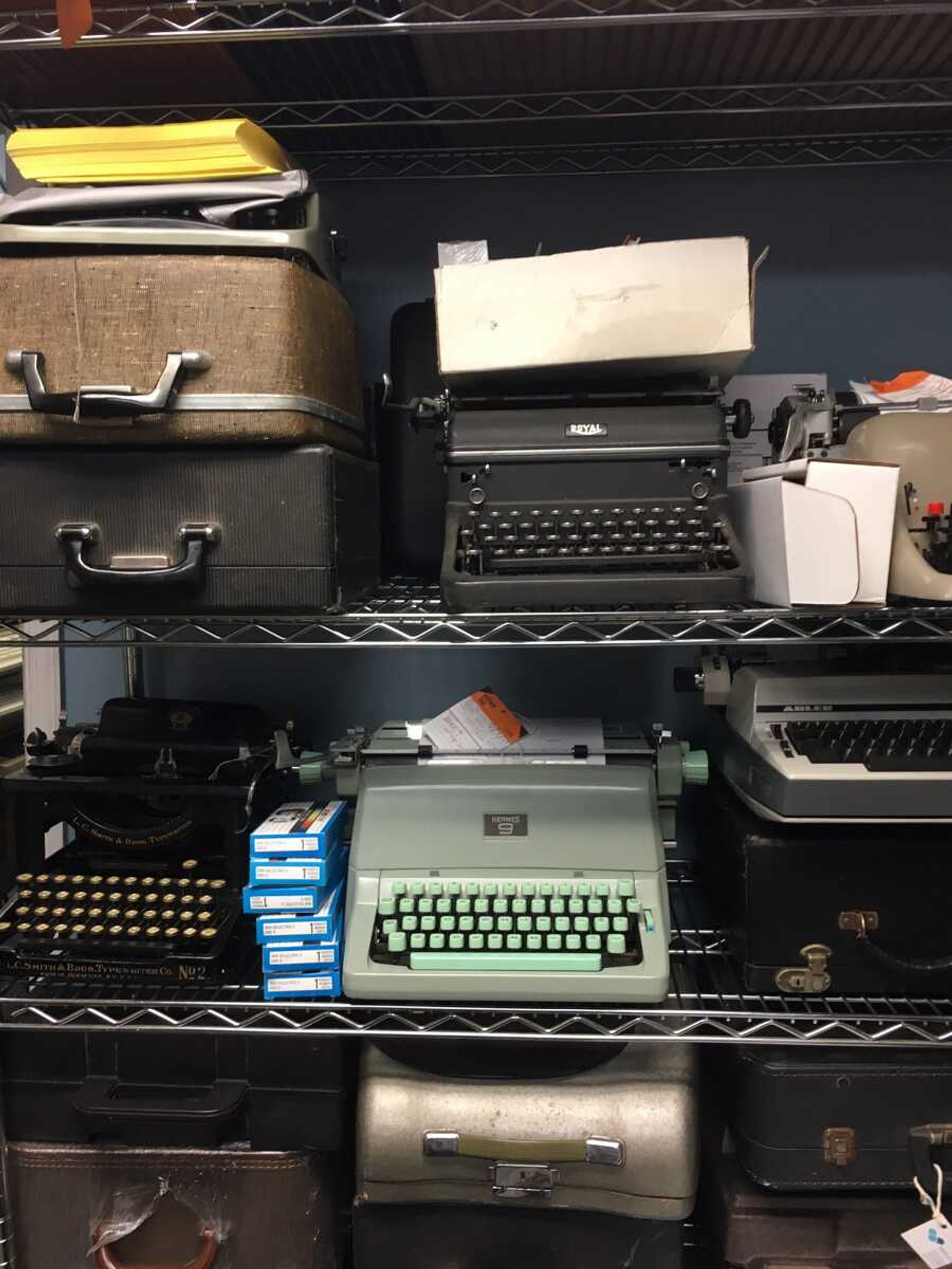 A shelf of vintage typewriters in the repair shop of the Gramercy Typewriter Co. is seen June 28 in New York.