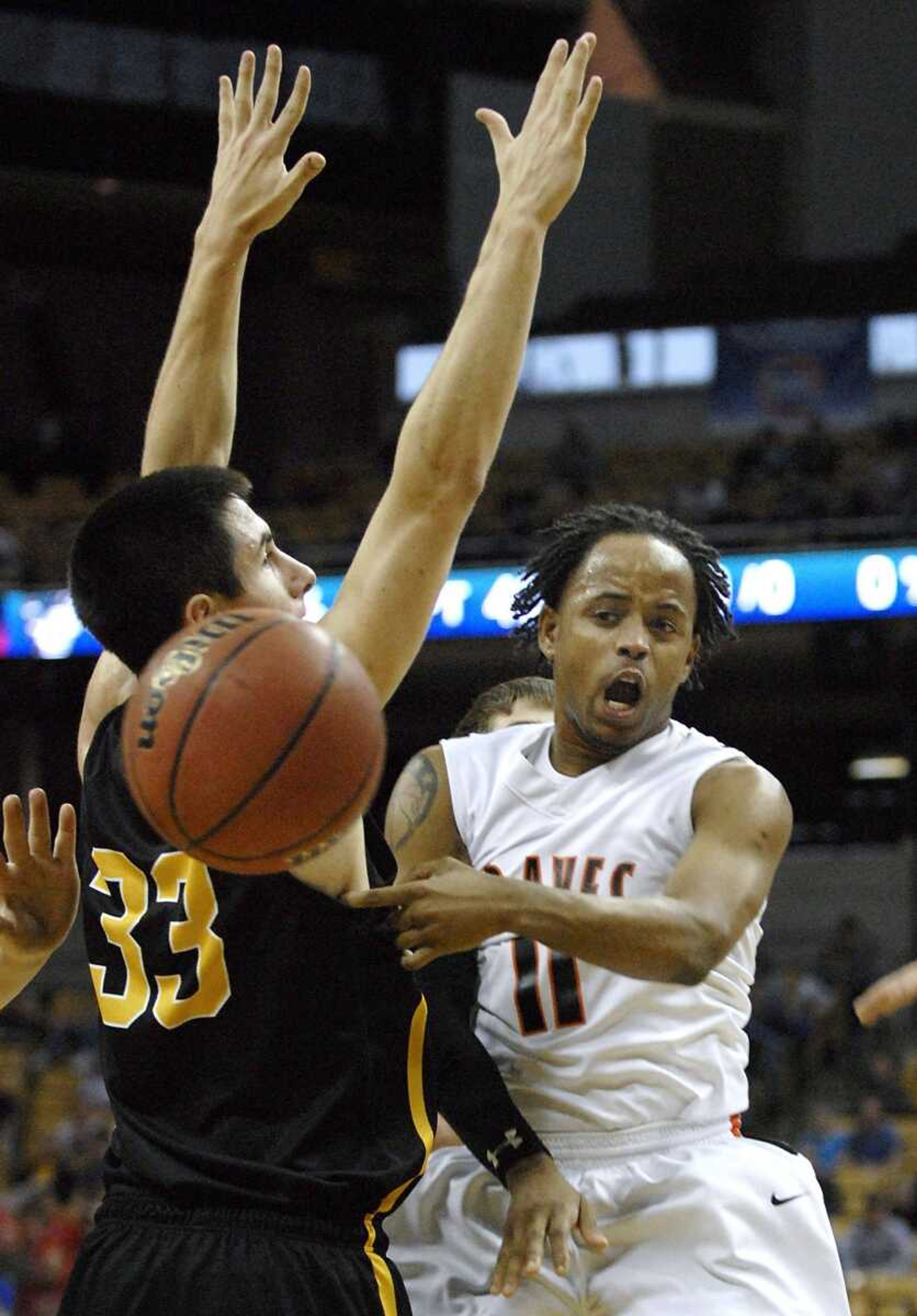 Scott County Central's Stewart Johnson passes around Dadeville's Dakota Webb during the second quarter of the Class 1 championship game Saturday in Columbia, Mo. Scott County Central won 69-54. (Kristin Eberts)