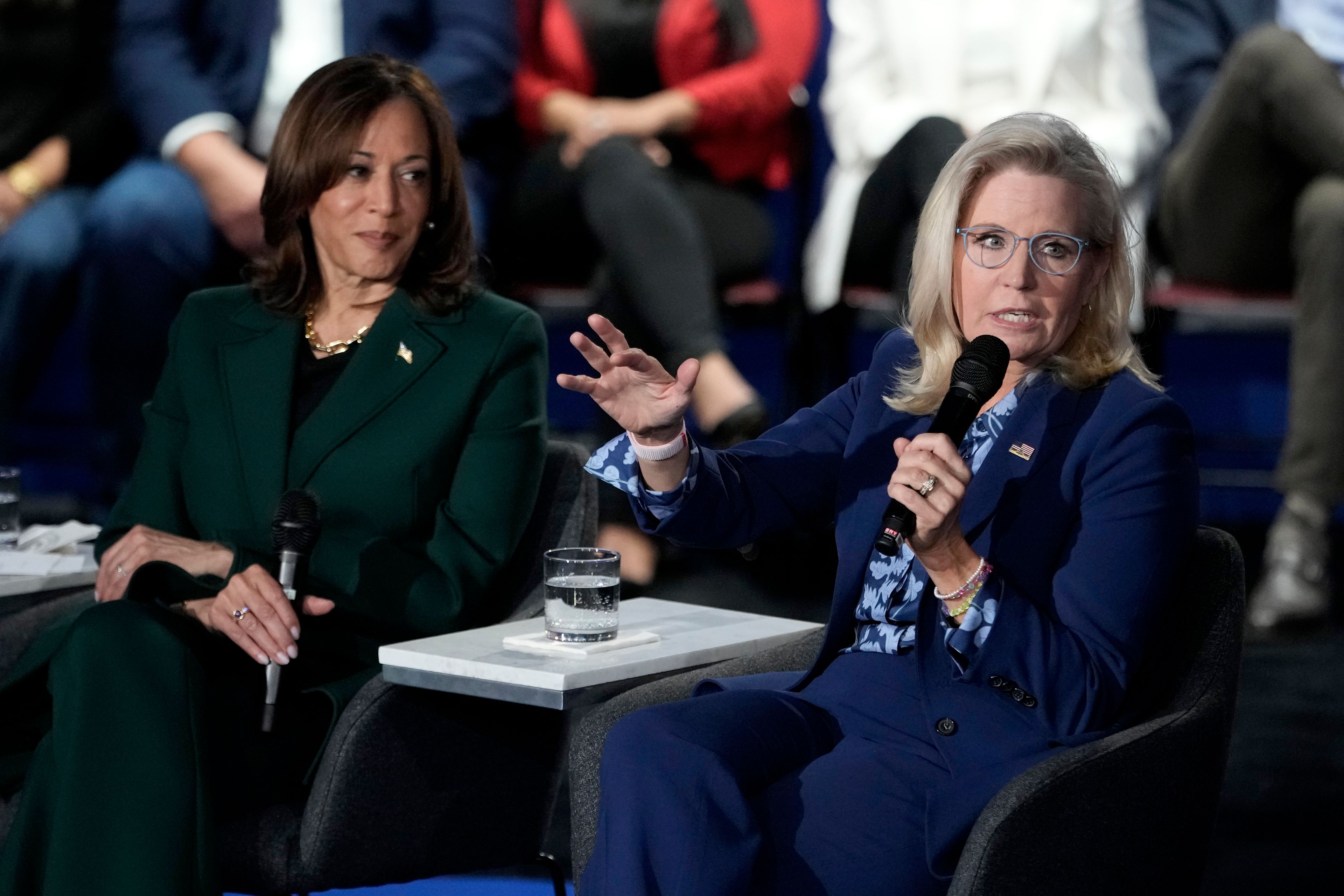 Former Republican Congresswoman Liz Cheney speaks as Democratic presidential nominee Vice President Kamala Harris listens during a town hall at the Royal Oak Theatre in Royal Oak, Mich., Monday, Oct. 21, 2024. (AP Photo/Carlos Osorio)