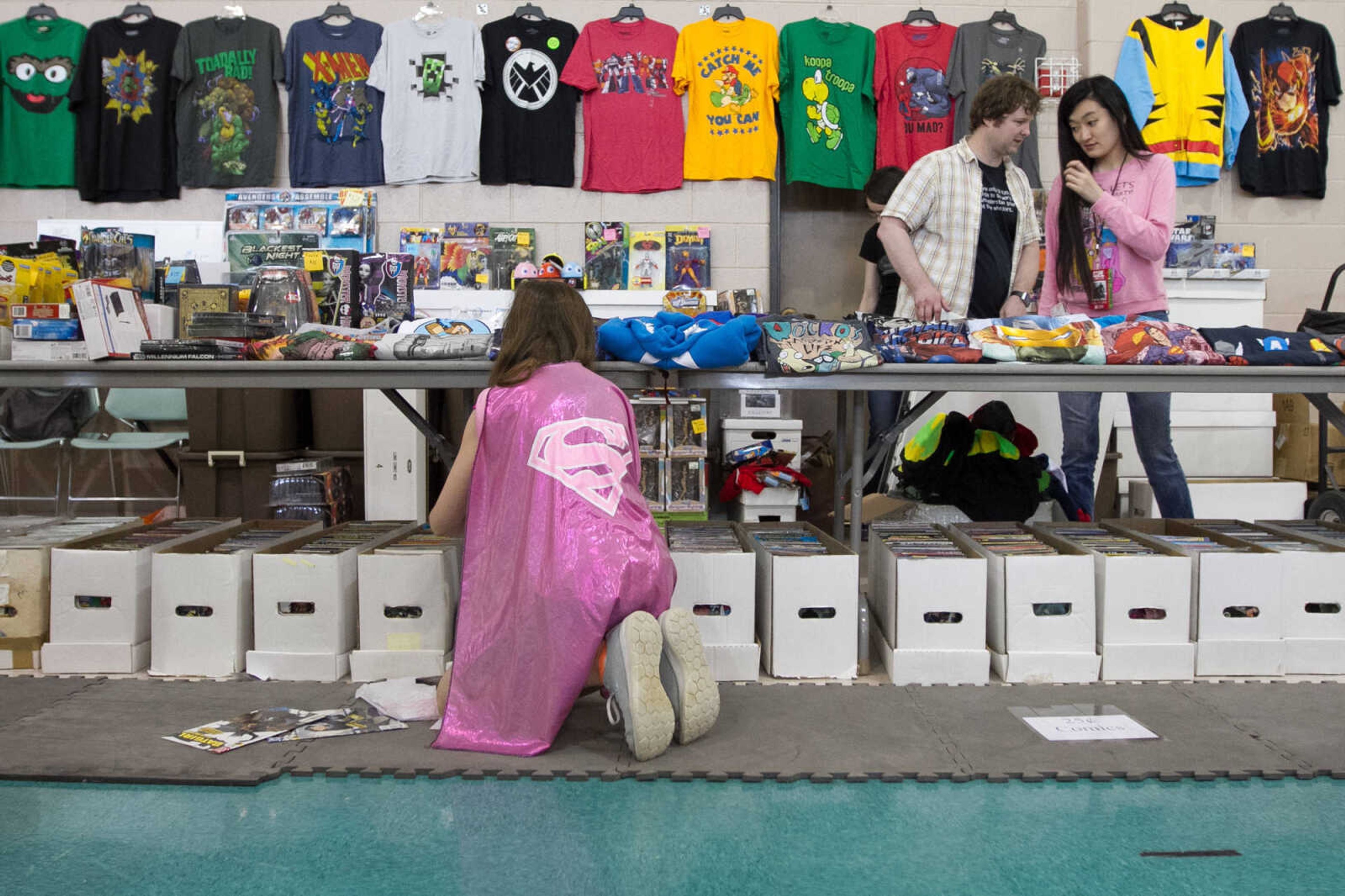 GLENN LANDBERG ~ glandberg@semissourian.com


Destiny Matysik hunts for a Superwoman comic book during Cape Comic Con Friday, April 17, 2015 at the Osage Centre.