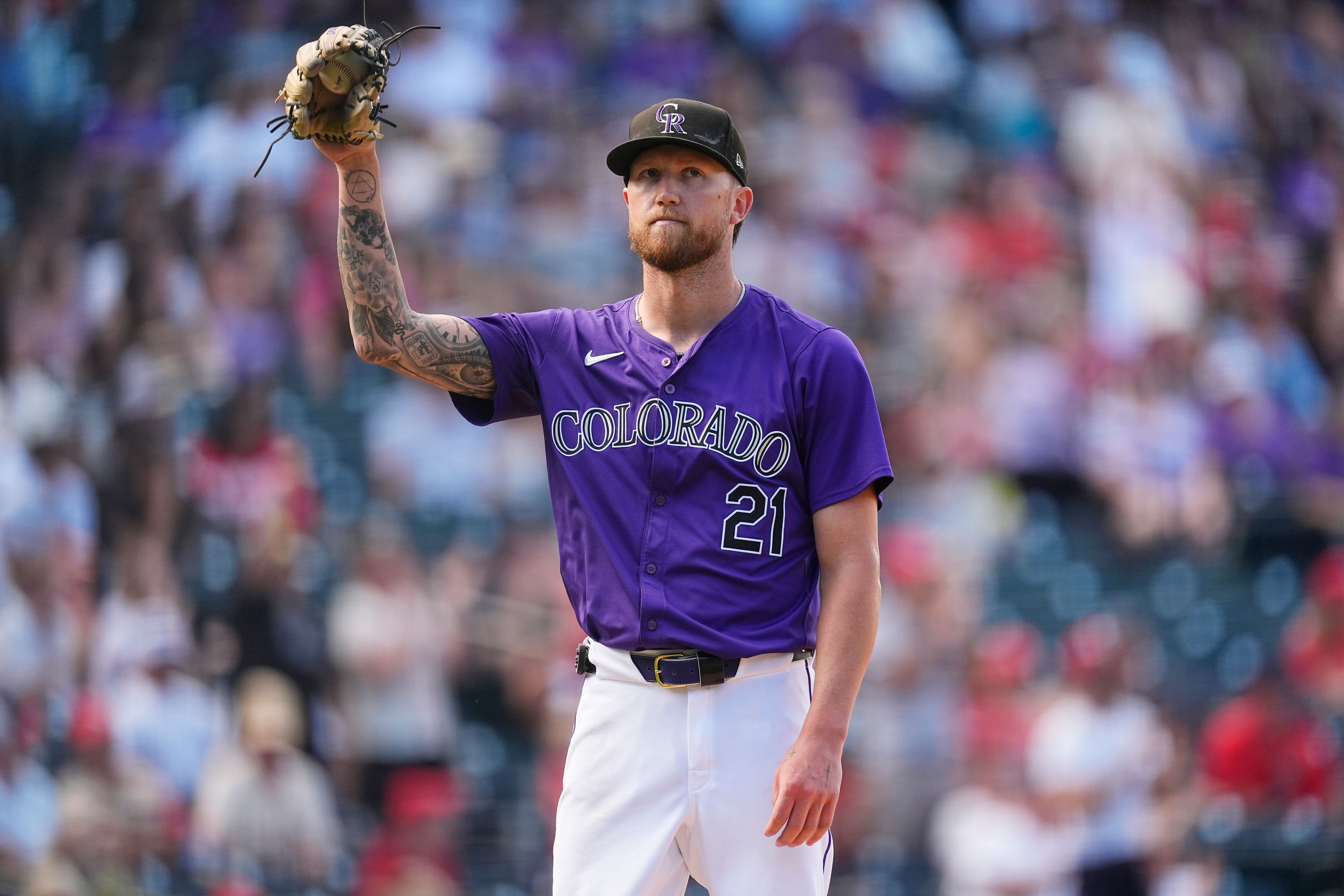 Colorado Rockies starting pitcher Kyle Freeland catches a new ball after giving up a solo home run to St. Louis Cardinals' Iván Herrera in the fifth inning of a baseball game Thursday, Sept. 26, 2024, in Denver. (AP Photo/David Zalubowski)