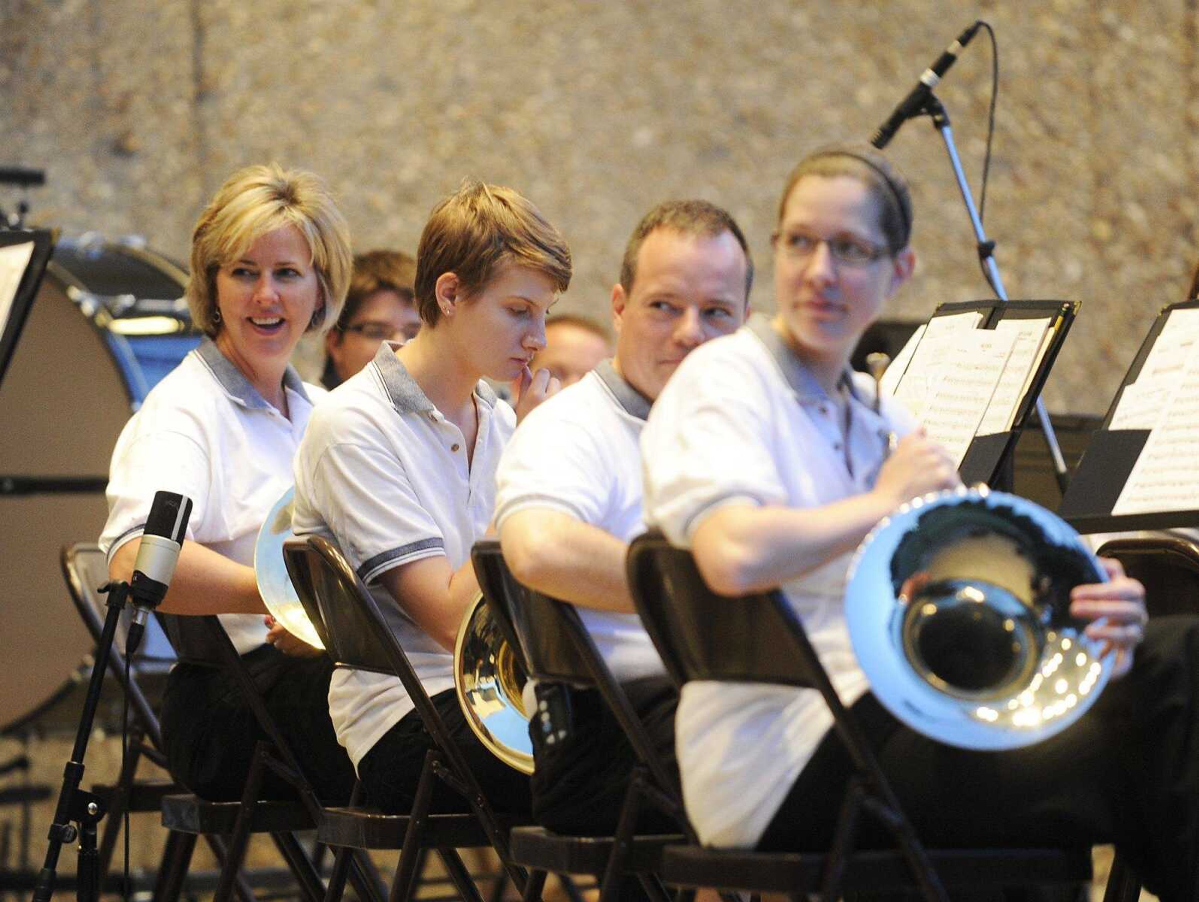 The French horn section turns to watch as Pete Parysek and Joseph Greer perform a dueling pianos routine during the Jackson Municipal Band concert June 14, 2012, at the Jackson bandshell in Jackson City Park. (Fred Lynch)