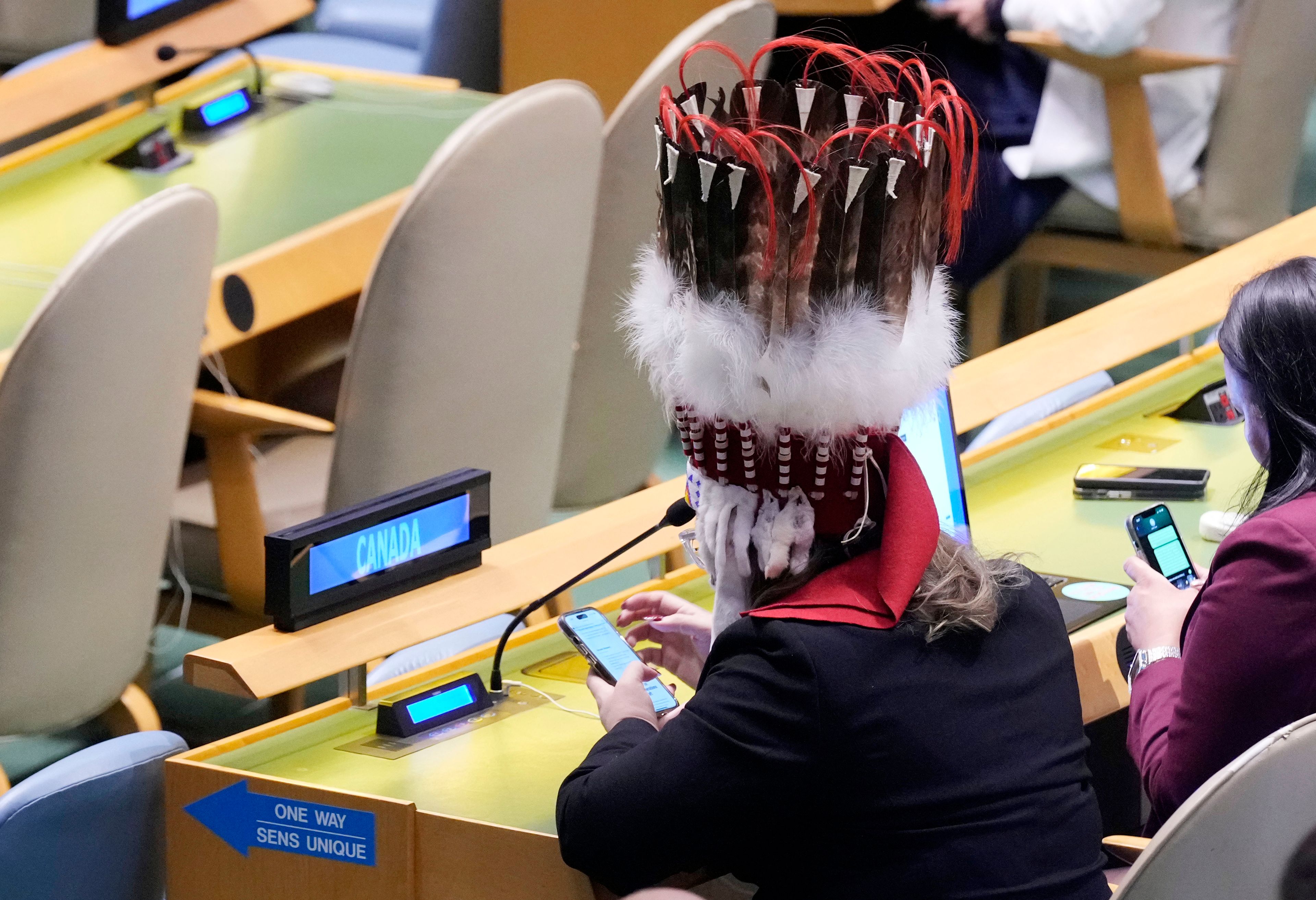 A member of the Canadian delegation attends the Summit of the Future, in the United Nations General Assembly, Monday, Sept. 23, 2024. (AP Photo/Richard Drew)