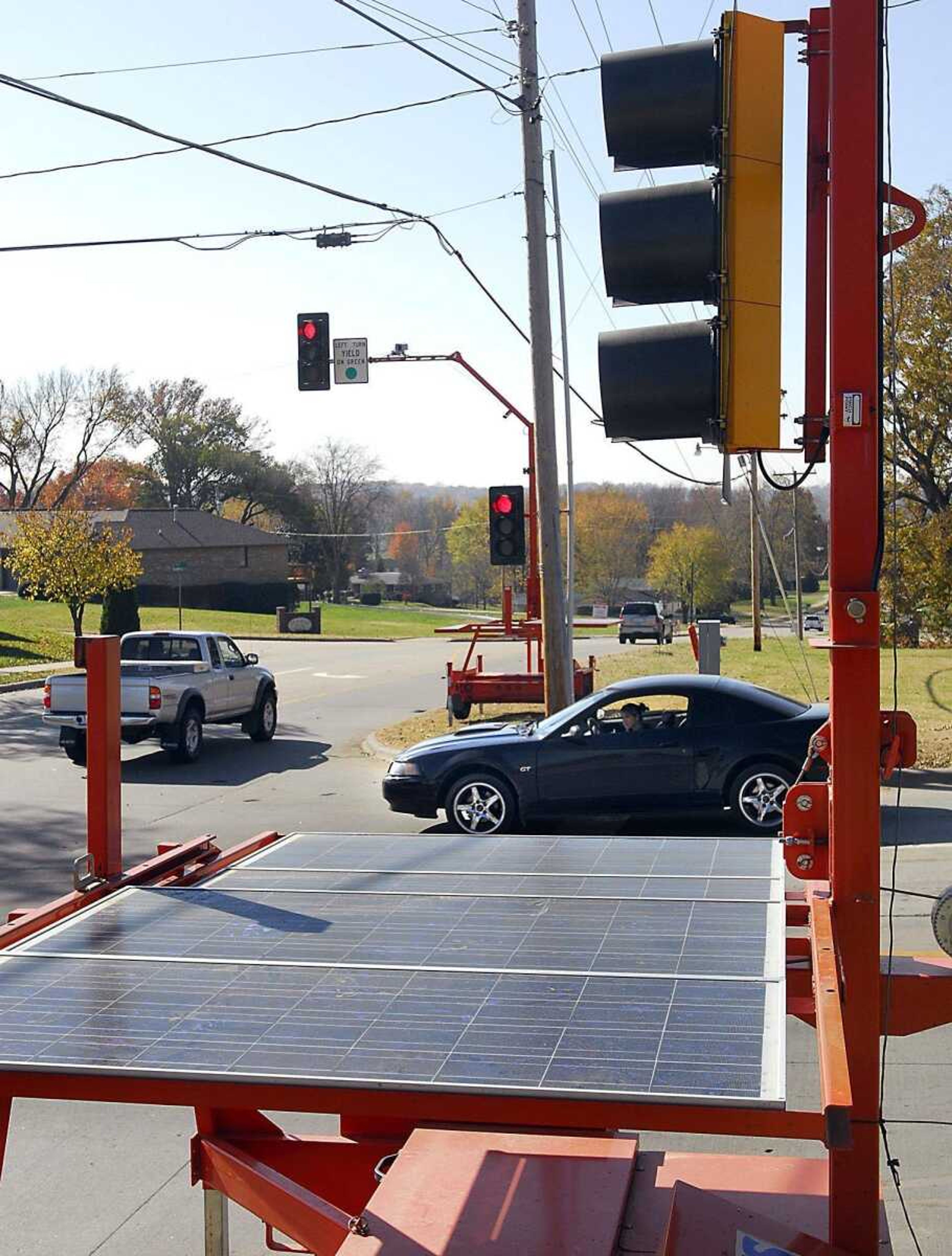 Four solar-powered traffic signals were set up at the intersection of Bloomfield and Silver Springs roads to help move traffic faster than a four-way stop for the next six weeks. (Fred Lynch)