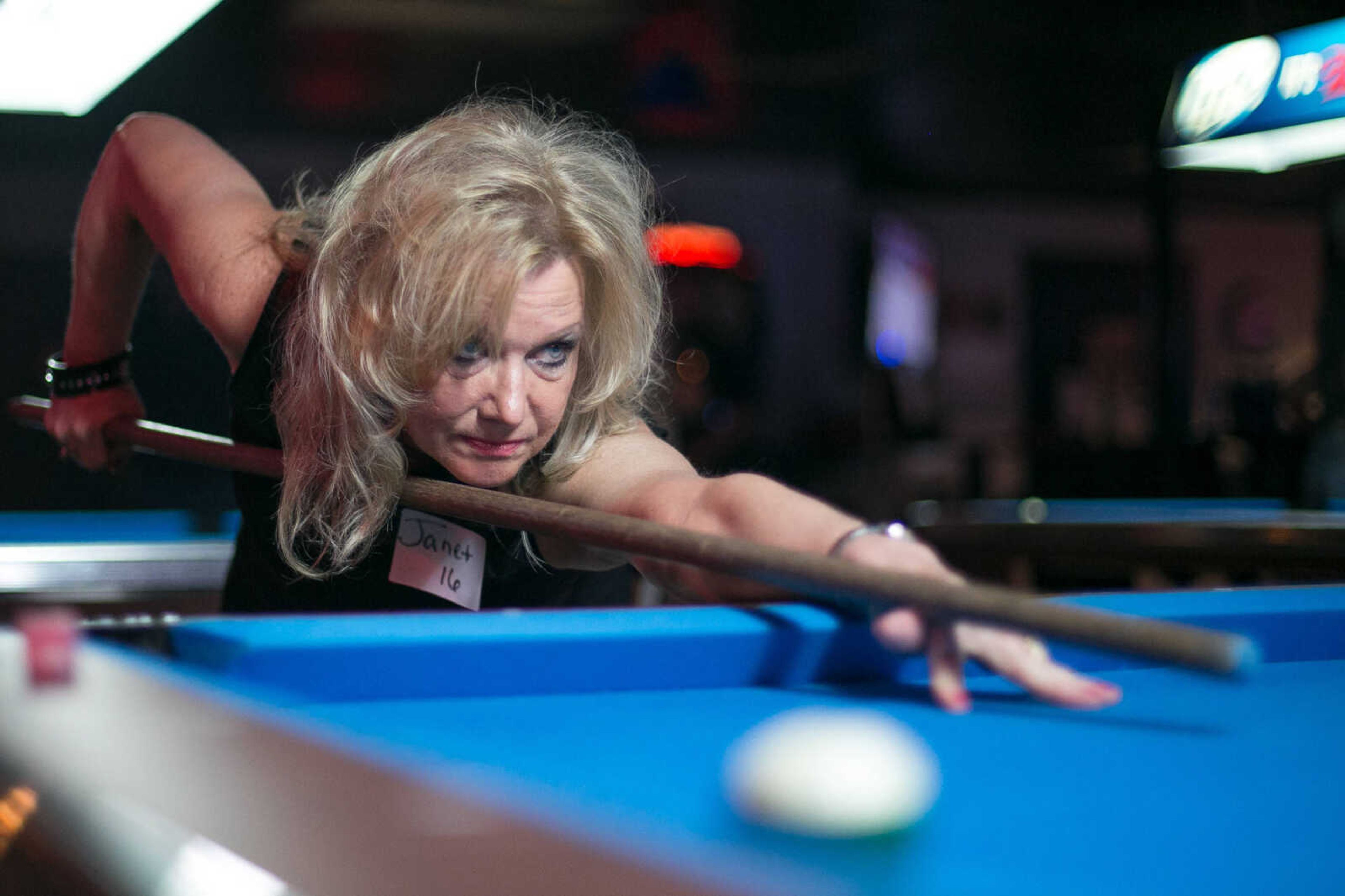 GLENN LANDBERG ~ glandberg@semissourian.com

Janet Eichhorn uses a broomstick to line up a shot during the annual broomstick pool tournament Saturday, Feb. 27, 2016 at JR's Bar & Billiards in Cape Girardeau. The tournament was sponsored by Local 16 SEMO, Freedom of Road Riders Inc.