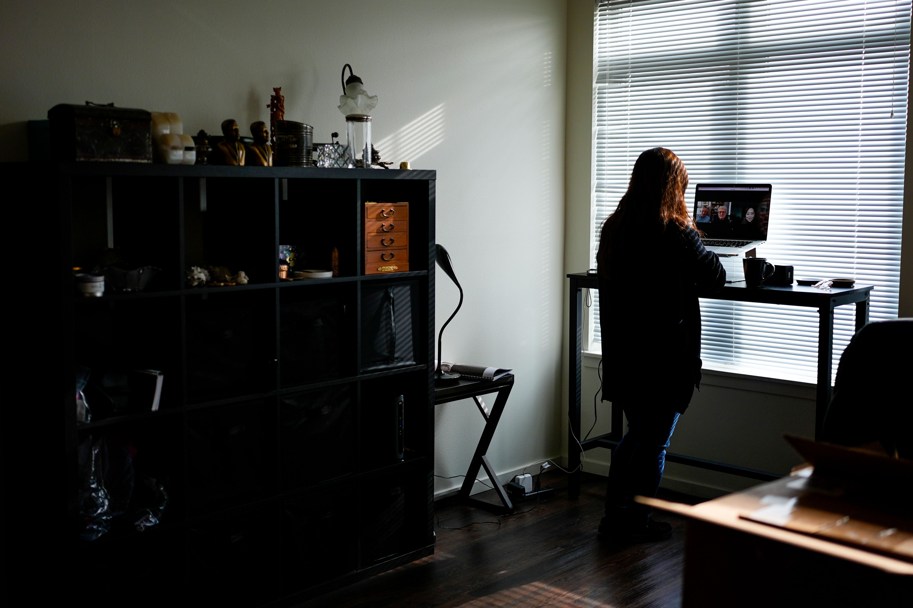 Rebecca Kimmel talks with her adoptive parents on her laptop at her home Saturday, Feb. 3, 2024, in Seattle. Her adoptive parents have also struggled with their unintended role in a deeply flawed system. Thousands of South Korean adoptees are looking to satisfy a raw, compelling urge that much of the world takes for granted: the search for identity. (AP Photo/Lindsey Wasson)