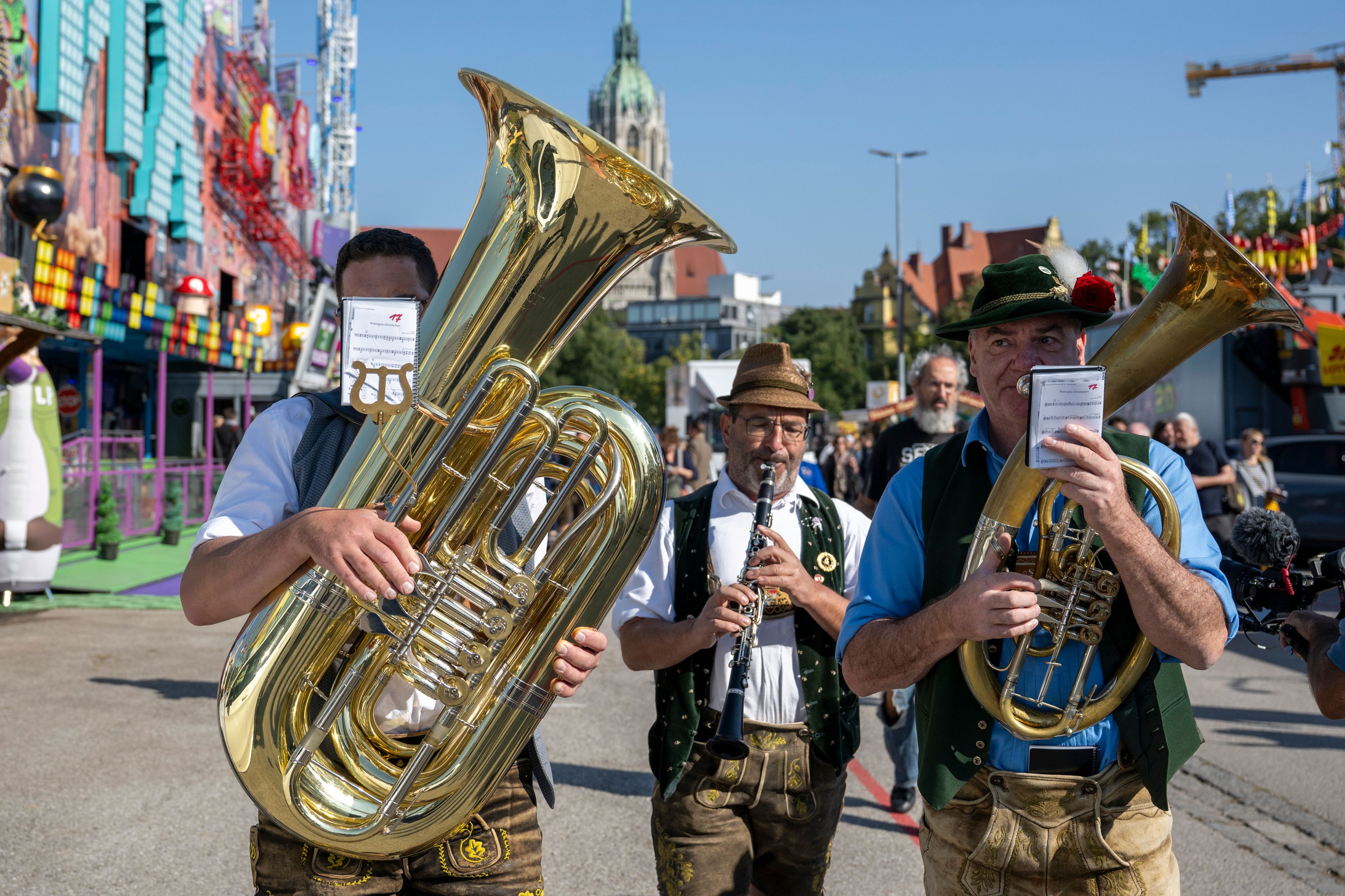 A brass band plays during a press tour at the Oktoberfest, in Munich, Germany, Thursday, Sept. 19, 2024. (Lennart Preiss/dpa via AP)