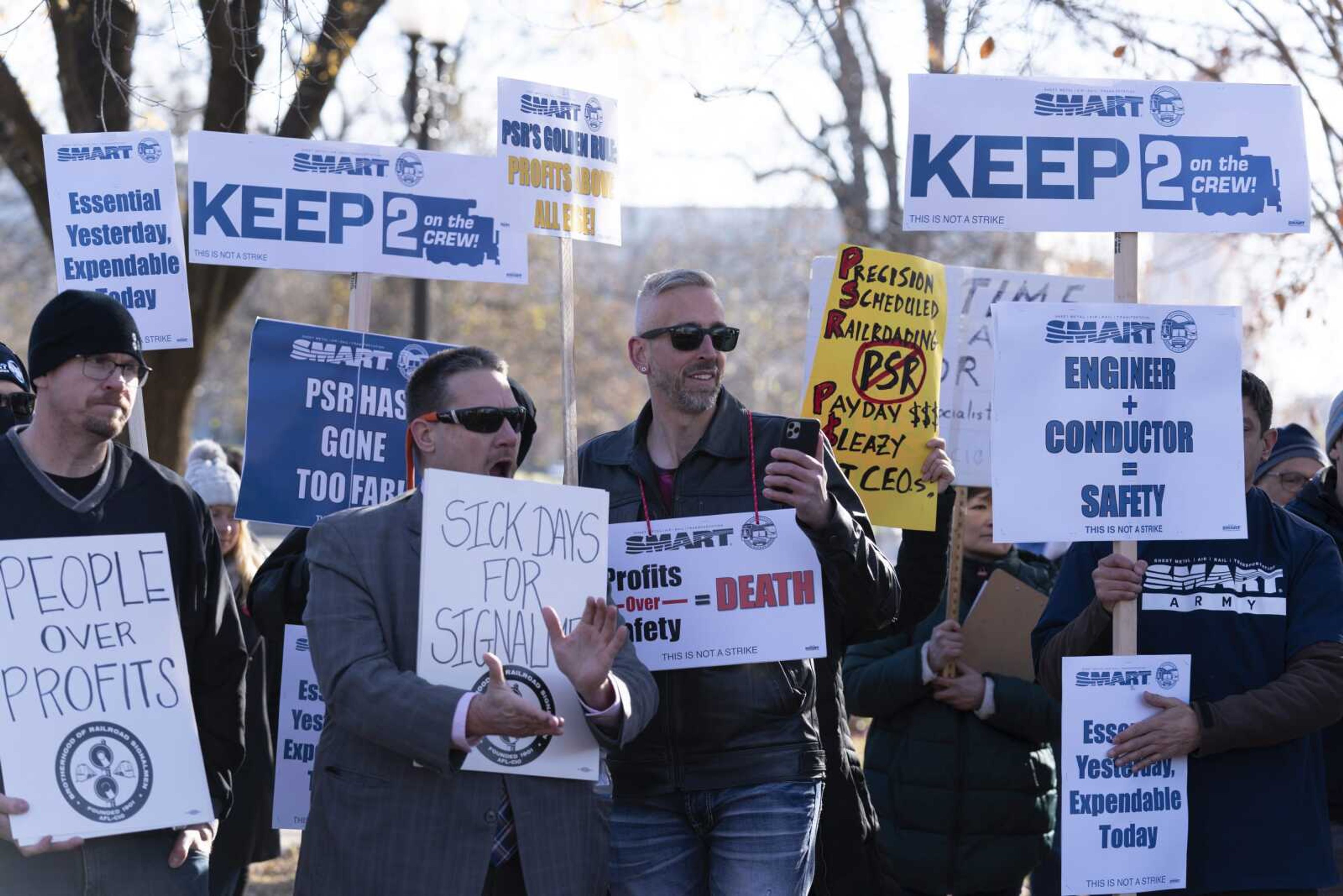 Workers of the two biggest rail unions rally outside of Capitol Hill on Tuesday, Dec. 13, in Washington.