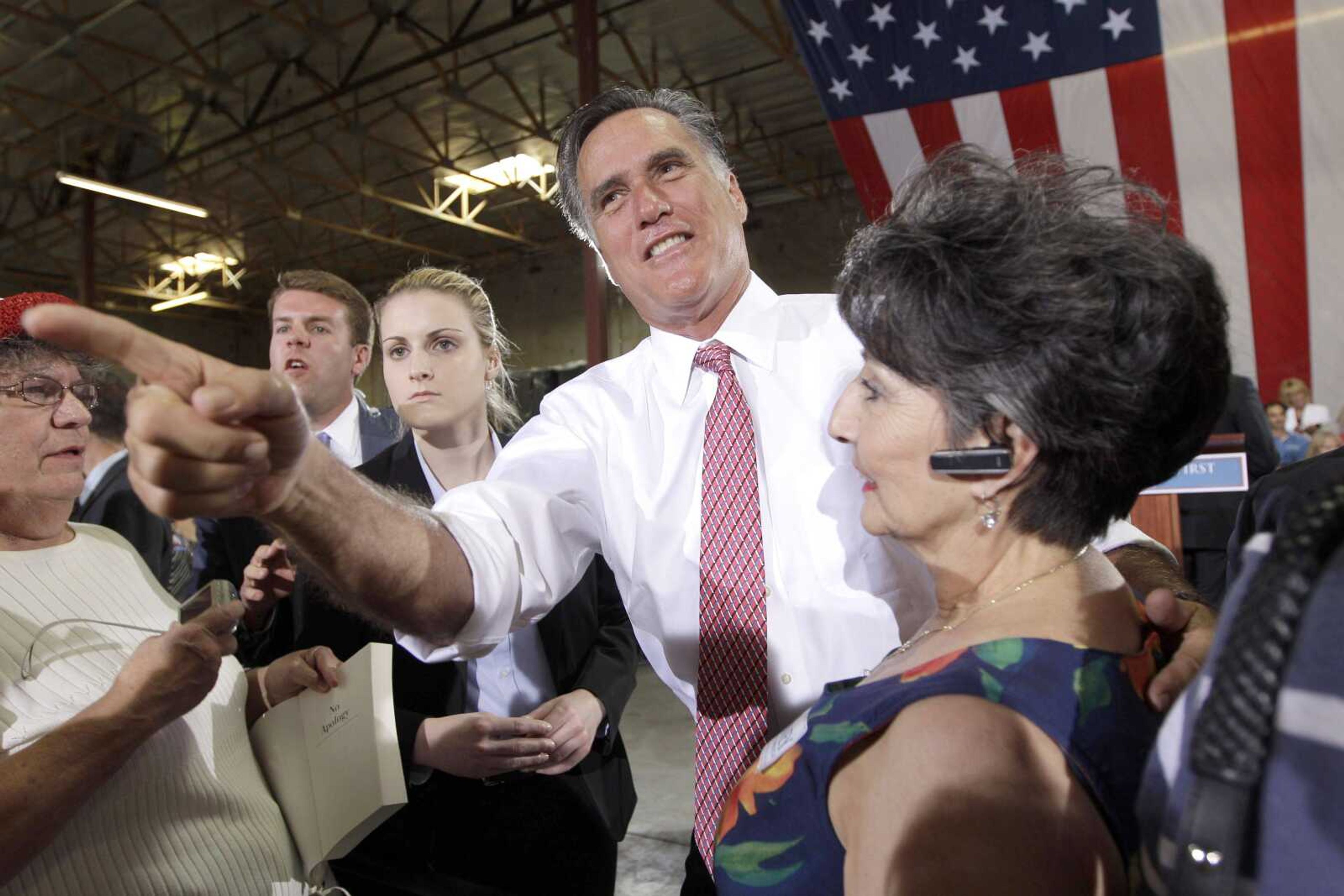 Republican presidential candidate Mitt Romney greets supporters after speaking at a campaign event Tuesday at the Somers Furniture warehouse in Las Vegas. (Mary Altaffer ~ Associated Press)