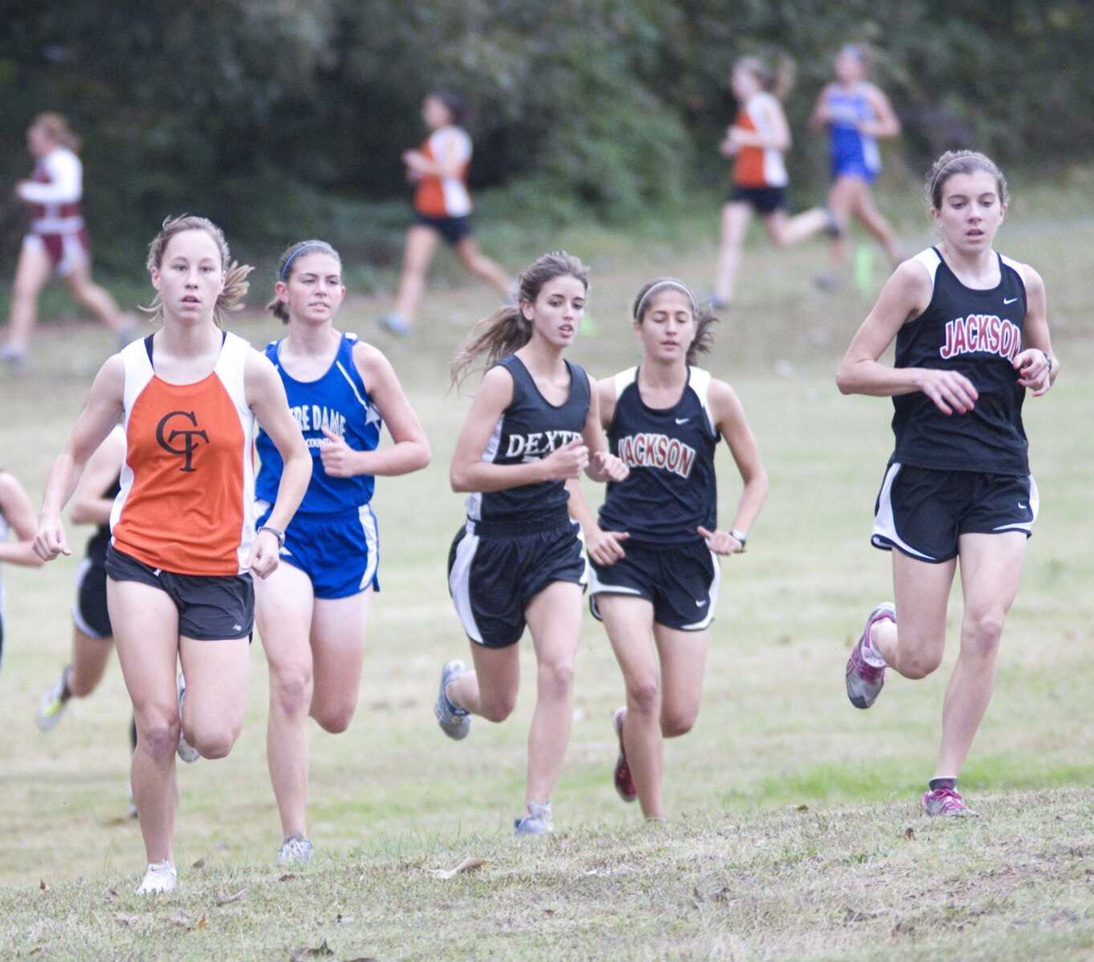 Central's Mary Dohogne, left, runs during Thursday's SEMO North Conference cross country meet at Ozark Ridge Golf Course in Poplar Bluff, Mo. (BRIAN ROSENER ~ Daily American Republic)