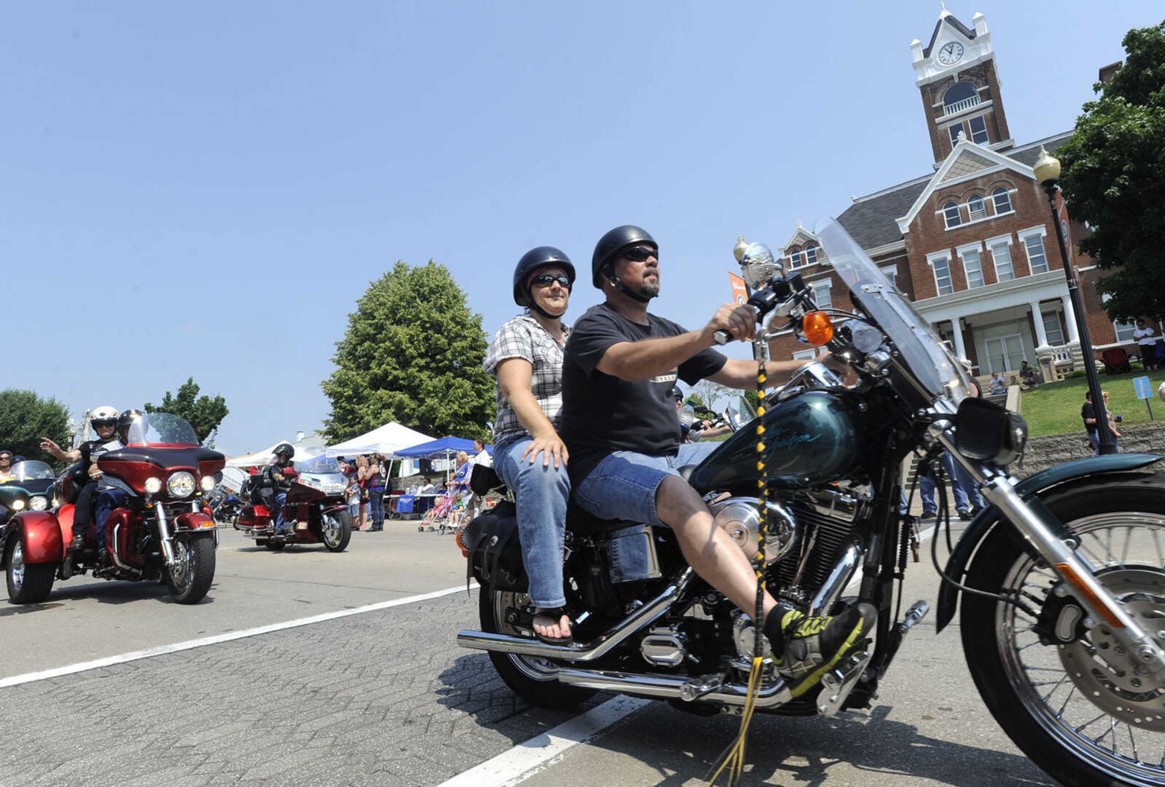 FRED LYNCH ~ flynch@semissourian.com
Motorcycle riders form a parade during the first Bikers on the Square event Saturday, June 22, 2013 in Perryville, Mo.