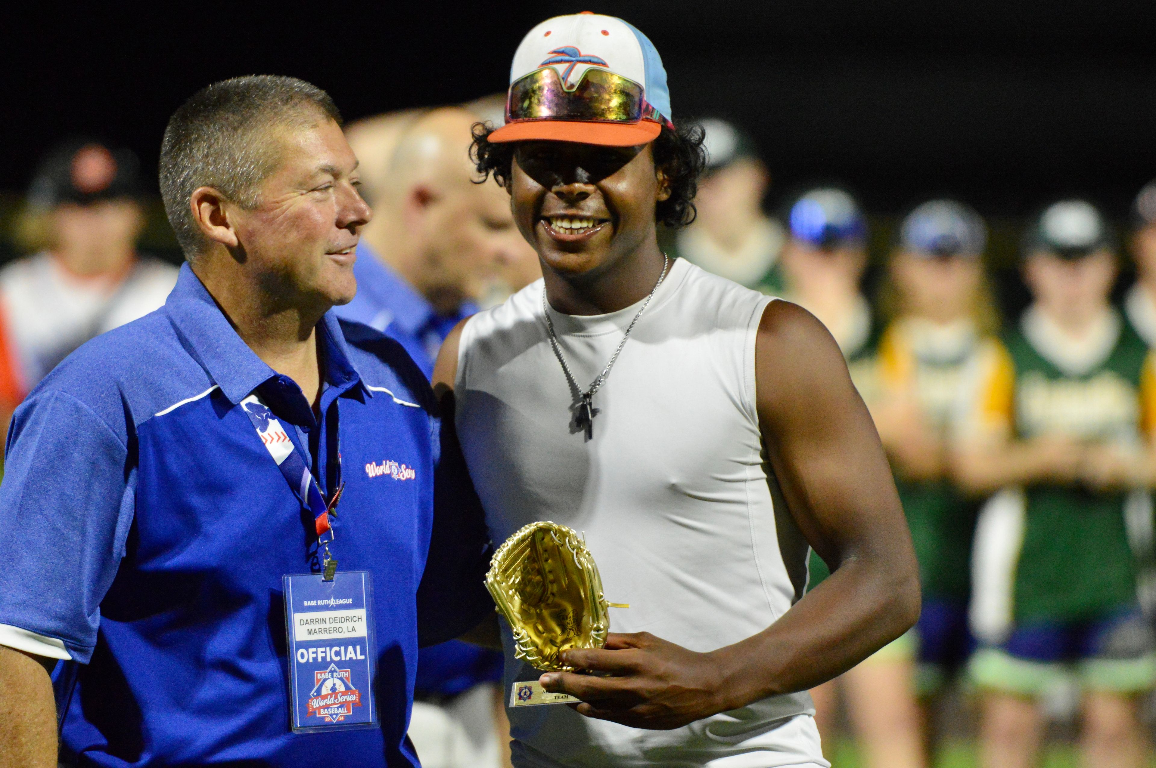 Southeast Tropics’ Aaron Dunlap is handed an all-star trophy at the Babe Ruth World Series on Thursday, Aug. 15, at Capaha Field in Cape Girardeau, Mo. 