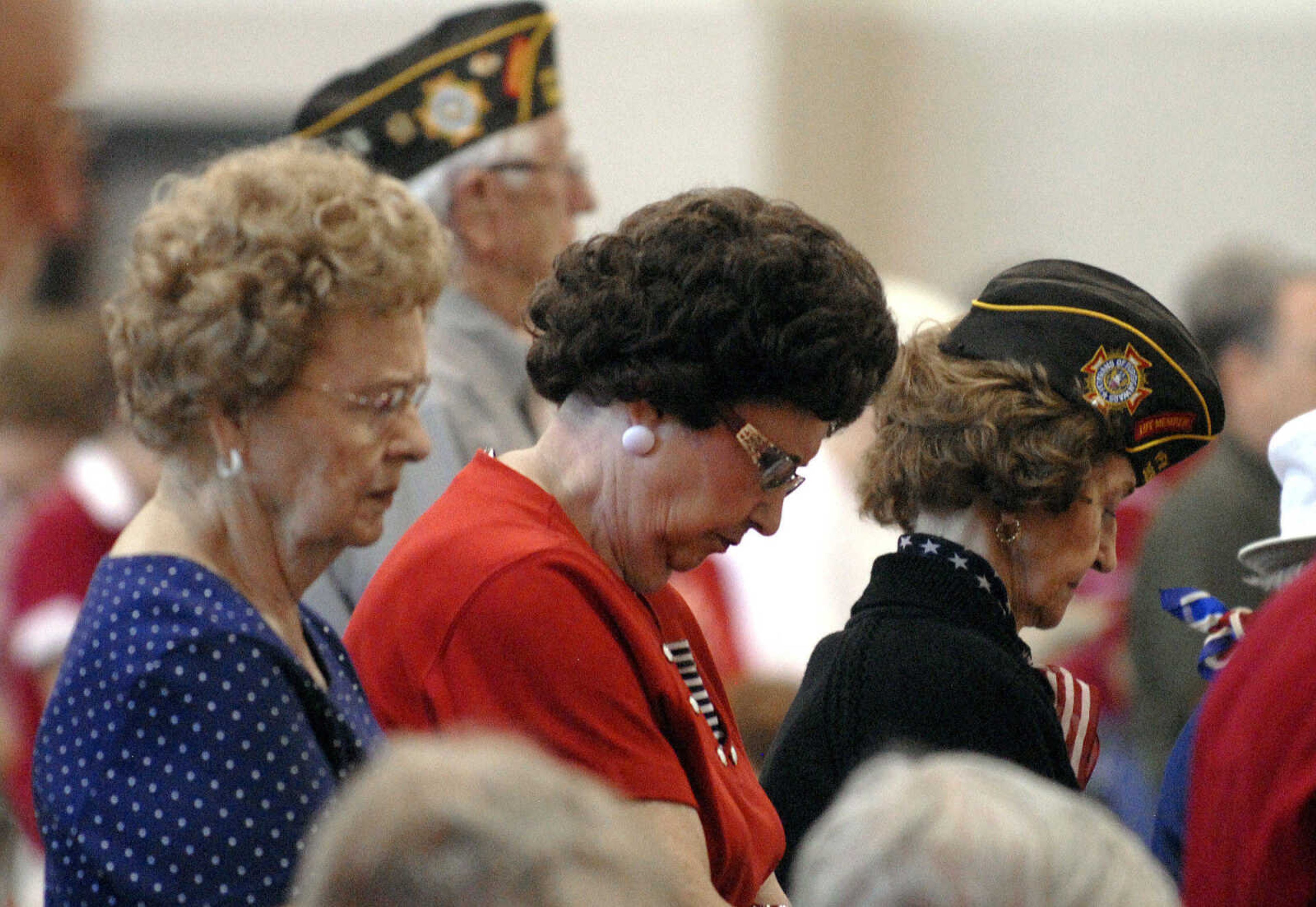 LAURA SIMON~lsimon@semissourian.com
Guests and veterans stand as VFW Post 3838 Chaplain Floyd Smith presents the invocation during the Memorial Day service Monday, May 30, 2011 at the Osage Centre in Cape Girardeau.