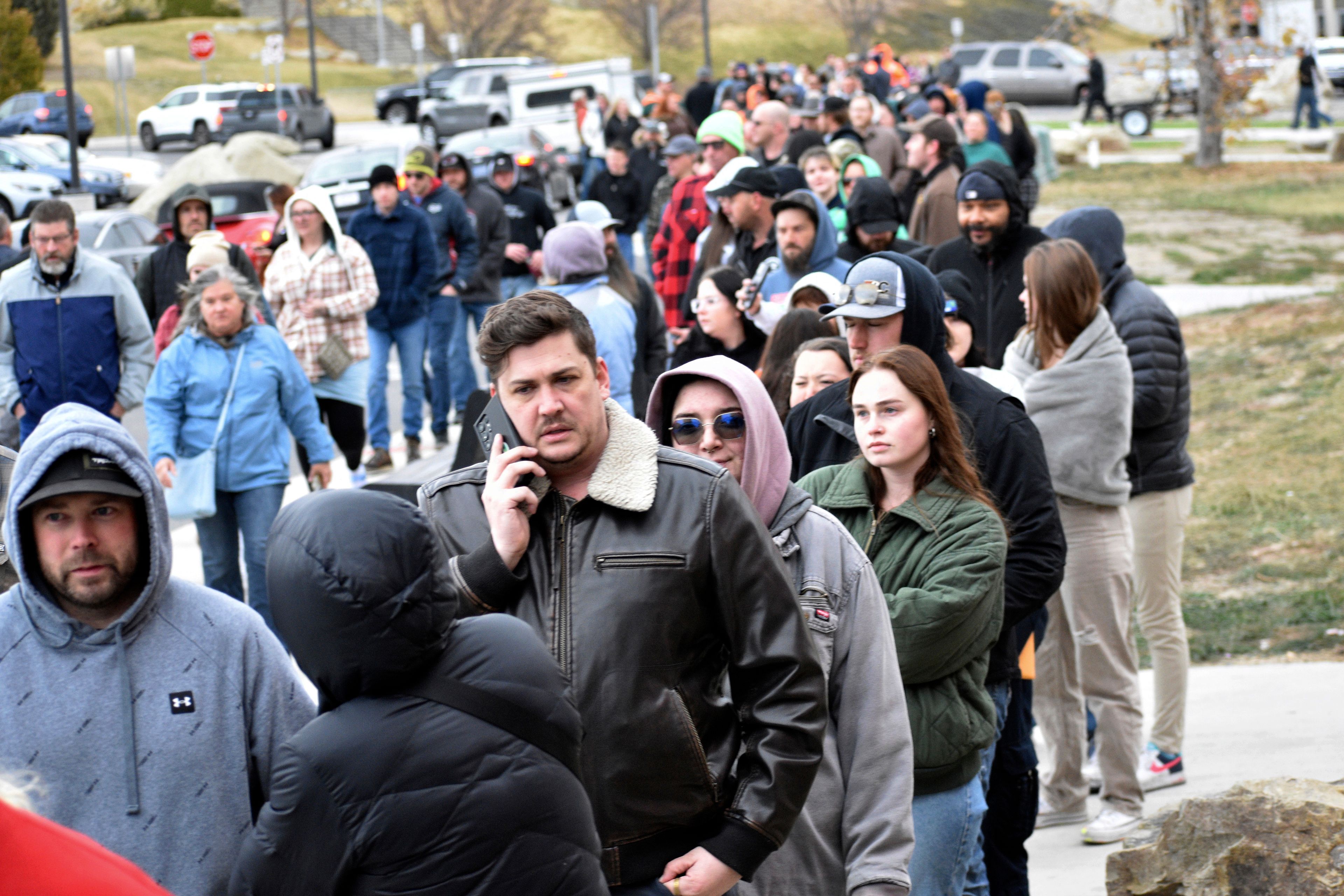 People wait in line to vote outside a polling place on Election Day at MetraPark, Nov. 5, 2024, in Billings, Mont. (AP Photo/Matthew Brown)