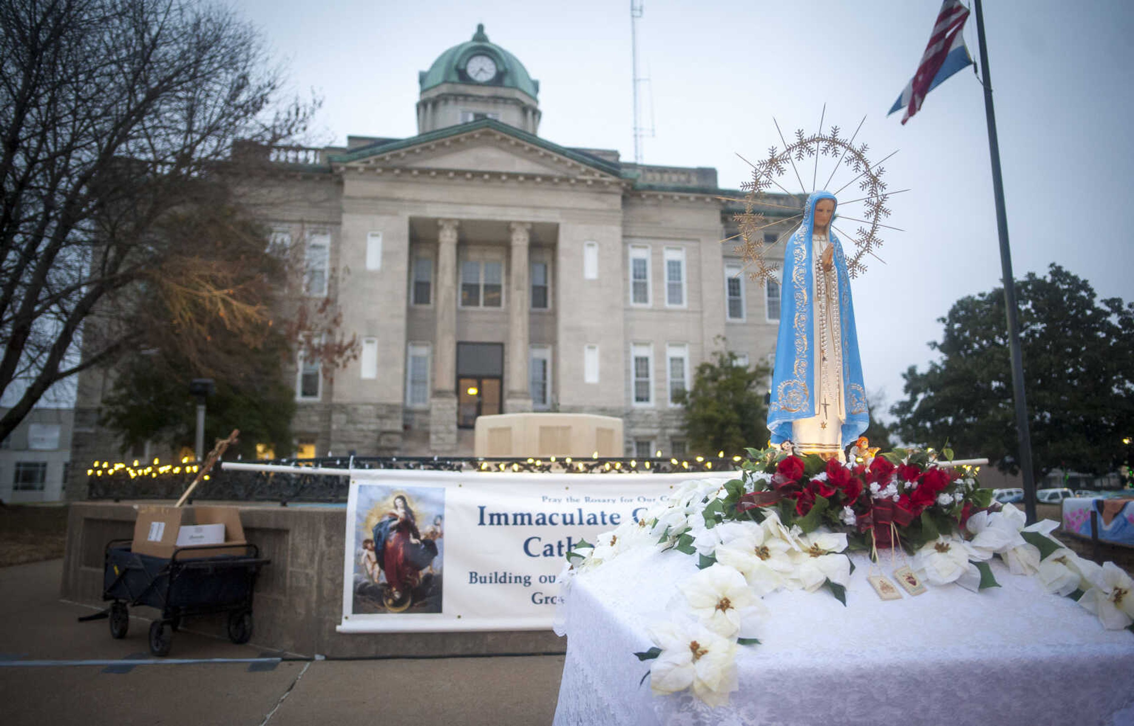 A statue of the Virgin Mary is seen in front of the Cape Girardeau County Courthouse before a Marian procession Sunday, Dec. 8, 2019, to recognize the 170-year anniversary of Immaculate Conception Catholic Church and to mark the beginning of the church's capital campaign to build a new church building in Jackson.